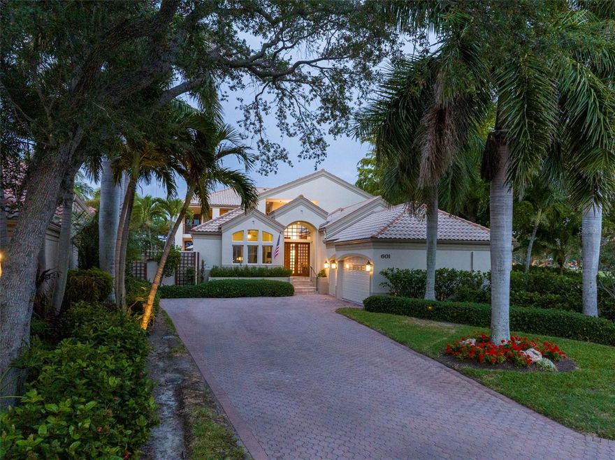 Located within the maintenance-free community of Weston Pointe in gated Bay Isles on Longboat Key. This waterfront home is a masterpiece of modern luxury. Serene and quiet with its Zen appeal. Built by the esteemed W.G. Mills company and Siebert Architecture leaving only the Façade, Casita and garage intact. This Architectural gem is a testament to quality, craftsmanship and the sturdy concrete construction exudes strength and durability. As you approach this 5,010 sq ft 4 En-Suite Bedroom, Casita, Den and Office home, you are welcomed by an expansive walled courtyard featuring the charming casita, saltwater lap pool, spa, seating areas, and outdoor kitchen with lush, tropical landscaping. Once inside the home, a world of natural beauty and modern elegance awaits. Rich cedar ceilings blend harmoniously with travertine floors and sapele-slatted wood. and cabinetry with cleverly designed hidden storage. Natural light floods the interior through two sets of floor-to-ceiling impact Sliders with captivating views of the outdoor courtyard, as well as your dedicated boat dock just steps from your door able to accommodate up to a 27 ft. boat, 10,000 lb. lift. The Bay Isles Community Association maintains the Seawall. The Community offers Marina dockage for the other homes in Weston Pointe with direct access to Sarasota Bay and the Gulf of Mexico with no bridges to bay. The homes thoughtful design extends to every corner, from the chef’s kitchen with a gas stove, stone countertops and custom cabinetry to the large laundry room/Butler’s pantry with a 86 wine refrigerator, ice machine, two drawer refrigerator, washer and dryer, sink. The main floor also offers a large Den/TV room and two en-suite guest rooms with beautiful built-ins. A walk-in cedar closet, and the generous 3 car garage that offers a lift for wheelchair accessibility. Beautiful Venetian plaster walls line the open hallway. A gorgeous cantilever wood staircase leads upstairs to the vast owner’s suite, offering a private sanctuary with its spa-like bathroom with jetted tub, and steam shower. Oversized walk-in closet. A second upstairs En-suite bedroom, currently used as a family room, boasts a wall of glass with sweeping views of the picturesque courtyard. Enjoy a spacious private office tucked away. Each of the 4 En-suite Bathroom showers and stone finishes are still the best quality offered today. The Designer finishes are timeless. Additional features include a coffee bar area, elevator, and a screened-in balcony overlooking the water. Located near Publix, CVS, banks, and other shops, this home combines the privacy of a secluded community with the convenience of nearby amenities. The Bay Isles Beach club is nearby. Experience the pinnacle of Waterfront living in this meticulously designed, One -of- a kind home, where every detail has been carefully curated to offer a harmonious blend of luxury and comfort. Sarasota, the City of Arts and Culture is just a few miles away. Forbes named Longboat key as one of 12 destinations to visit in 2025. The new St. Regis Resort is less than 2 miles away.