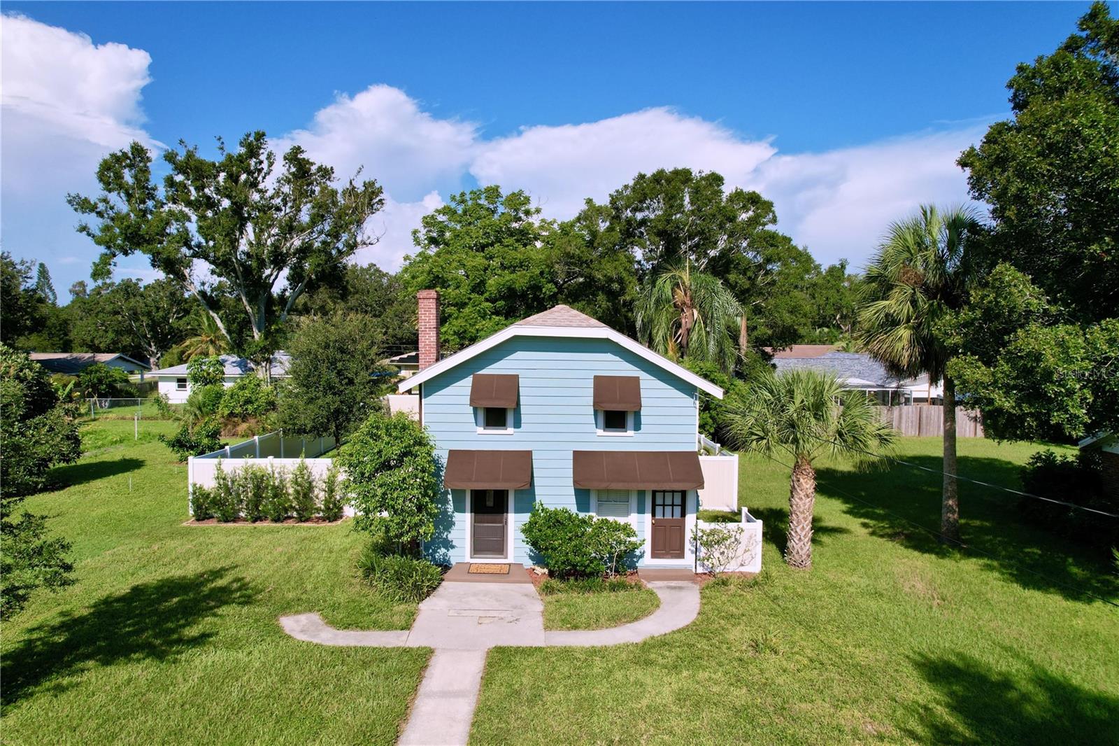 Charming with Vintage Character and Well Cared for Home on .26 acres. Original Hardwood floors upstairs, pre-war glass window panes, original brick fireplace behind wall in living room. Fresh Paint inside and outside. Water Heater 6 years old. New blinds. Newer Electrical. A/C 4 years old. Upstairs Bath remodeled. New Vinyl Fence. New Awnings front and back. Recessed lighting in Kitchen. Refurbished interior Doors. Roof under 10 years old. New Washer. Pantry under stairs. New shell driveway. Home is setback approximately 100 ft from the street offering privacy Huge private vinyl fenced backyard with a 462 sf detached workshop that can easily be converted into a studio, in law quarters, office, etc. New raised composite deck in back for enjoyable relaxation. Located in the heart of Largo's Old Northwest, Centrally located to Largo Central Park, Bus Lines, Restaurants, Shopping, and minutes to our Beautiful Sandy Beaches.