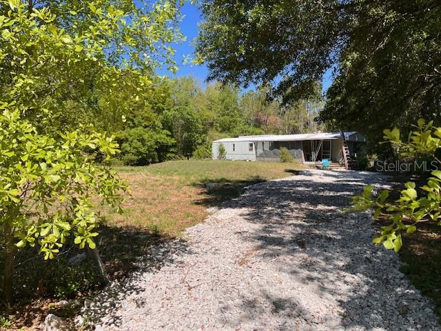 Welcome to your new blank canvas to build your dream home! Just off of Tom Costine Road lies your secluded and woodsy 5+ acres of residential land with 1 acre fully fenced backing up to a beautiful nature conservation area filled with a plethora of wildlife, making this area the perfect getaway from the hustle and bustle of life. The seller is very motivated!
Manufactured home on the property has no material value. Buyer is responsible for removing the structure and verifying any plans with the Polk County Planning and Zoning office.