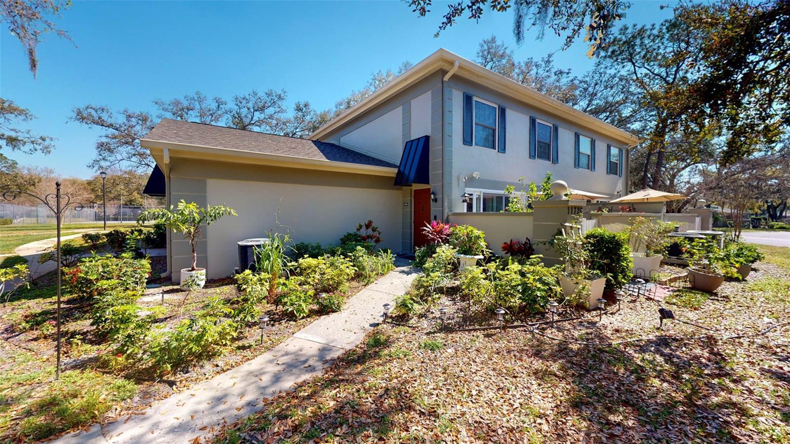 Raintree Manor is a beautiful community with mature oak trees and centrally located minutes to USF and I-75/I-4. This beautifully updated 2 Bedroom/2 Bath townhome comes with an attached one-car garage. This bright and airy two-story townhome features an open floor plan, tile flooring downstairs, and carpet in the bedrooms upstairs. The kitchen was recently updated and features quartz countertop, shaker cabinets, and stainless-steel appliances. An updated bathroom downstairs is great for guests. A wooden staircase leads to the two bedrooms and bathroom upstairs. This updated bathroom features a walk-in shower with a rain shower. The living room opens onto a spacious patio. The washer and dryer are inside the home. Only pay for your electrical bill since the rent INCLUDES basic cable, internet, trash, sewer, water, and recycling!! Raintree Manor offers 2 pools, a clubhouse, and 4 tennis/pickleball courts.