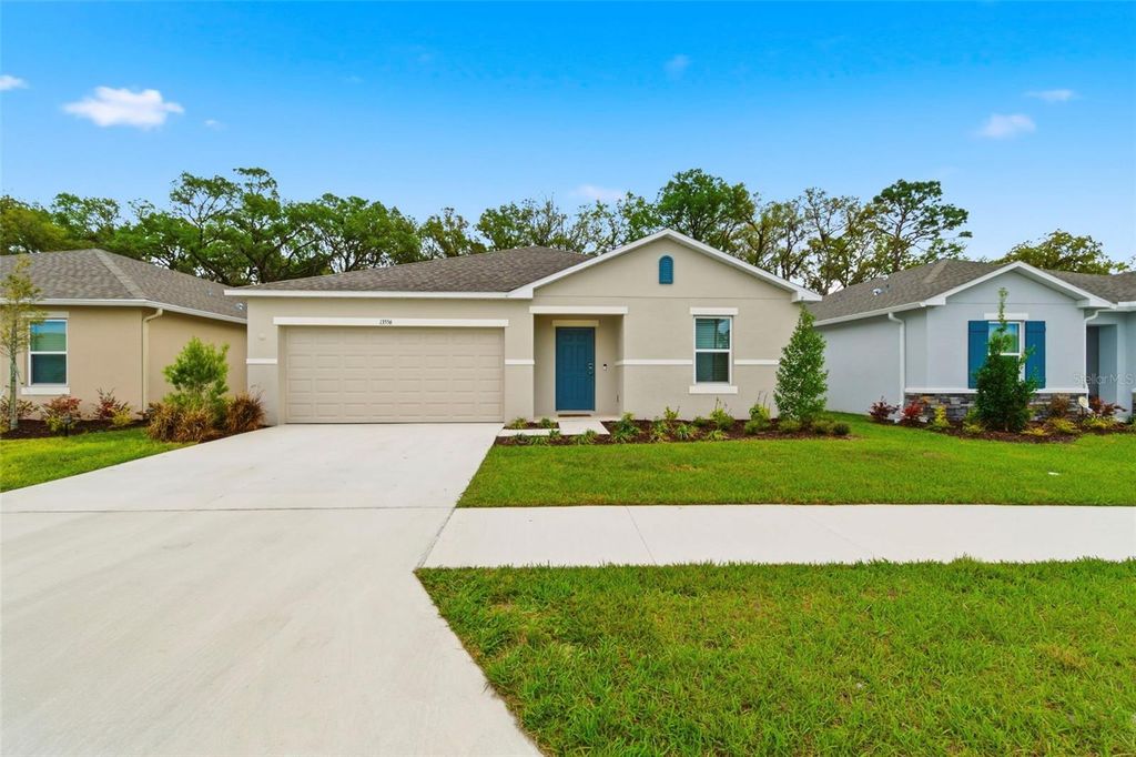 Photo of 13556 Tropical Breeze Way, Hudson, FL 34669 (MLS # TB8486941)