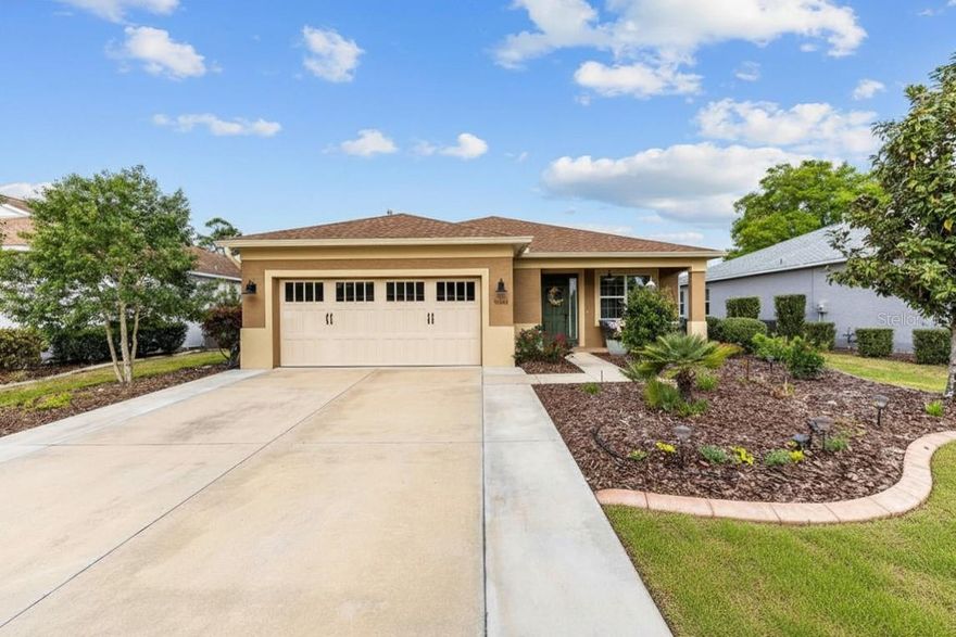 Welcome to this gorgeous Orchid model in the award-winning 55+ community - Indigo East of On Top of the World! Your low-maintenance lifestyle begins here; morning coffee on your front porch, an afternoon golf cart ride to one of the many community pools, and evenings hosting friends and family in your upgraded home. This 2019-built residence offers over 1,800+ SF of living space - a standout feature of this floorplan is the versatile office, formally converted into a bonus room with enclosure and closet, making this Orchid model a 4 bedroom/2 bathroom home! Enjoy extra space for your hobbies, or room for guests. Your spacious gourmet kitchen showcases ample cabinetry with thoughtful storage inserts, a full stainless-steel appliance suite featuring a gas cooktop and built-in oven/convection microwave, and a dedicated pantry. The open floorplan flows seamlessly into your tiled living and dining room spaces, perfect for relaxing and entertaining. Guests can find privacy in their own wing with 2 bedrooms (new carpet 2025) and full bathroom. The primary suite offers a spacious layout with new carpet (2025), a walk-in closet with new organization system, and accessible ensuite with dual vanities, linen closet, and walk-in tile shower with bench. Slider doors lead to your screened lanai overlooking your private fully-fenced backyard. Outside, you’ll love the whole-yard irrigation system, new landscape curbing (2025), brick paver patio, and fresh plantings/mulch. The 2-car garage also features epoxy flooring and fixed garage shelving. Other upgrades include full interior painting (2025). Imagine having access to multiple community pools, an on-site 3,400+ SF fitness facility, and community center all within Indigo East. Beyond the gates, enjoy the direct golf cart routes to the local Publix, Circle Square Commons, and surrounding shops from the comfort of your own golf cart! This incredibly well-maintained home is ready for its new owners - it’s time to sit back, relax, and enjoy this amenity-rich lifestyle!