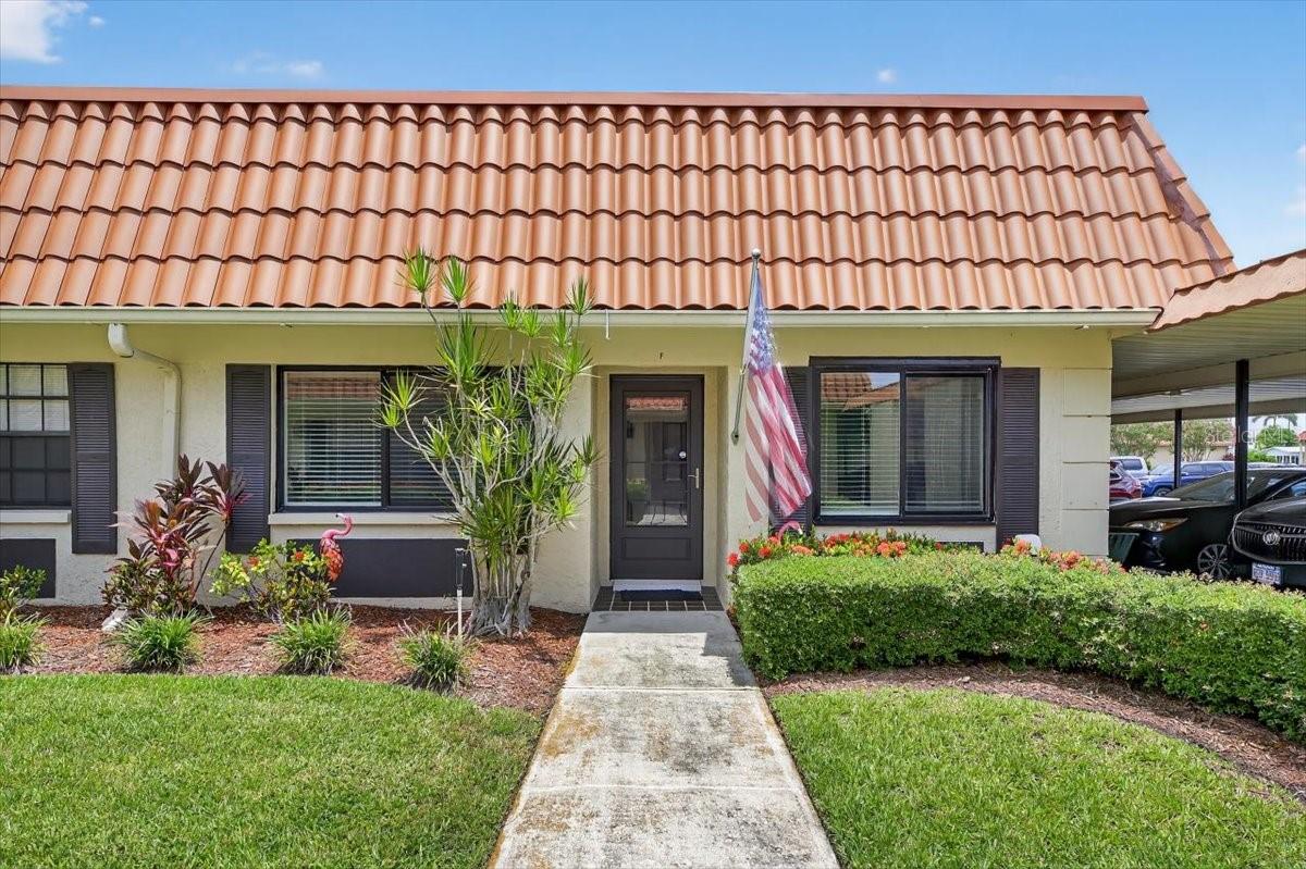 Welcome to this gorgeously remodeled 2-bedroom, 2-bathroom home nestled in the highly sought-after Imperial Cove neighborhood. This expansive end unit boasts a prime location directly across from the scenic walking path along the canal, offering the perfect setting to soak in breathtaking sunrises or tranquil sunsets just steps from your door. Inside, you’ll discover a beautifully updated kitchen featuring generous eat-in counter spaces, elegant white cabinetry, and stylish accent lighting, providing both ample storage for all your culinary essentials and charming spots to showcase personal treasures. The spacious living and dining area invites you to relax in comfort or entertain guests with ease, while the enclosed porch, bathed in natural light, offers a serene retreat for reading or birdwatching. Throughout the main living spaces, modern floor tile and fresh paint create a crisp, contemporary ambiance, leaving nothing for you to do but move in and start enjoying the exceptional community amenities, including a clubhouse, swimming pool, and fitness center. Don’t miss your chance to call this delightful home your own—schedule your showing today and meet your wonderful new neighbors!