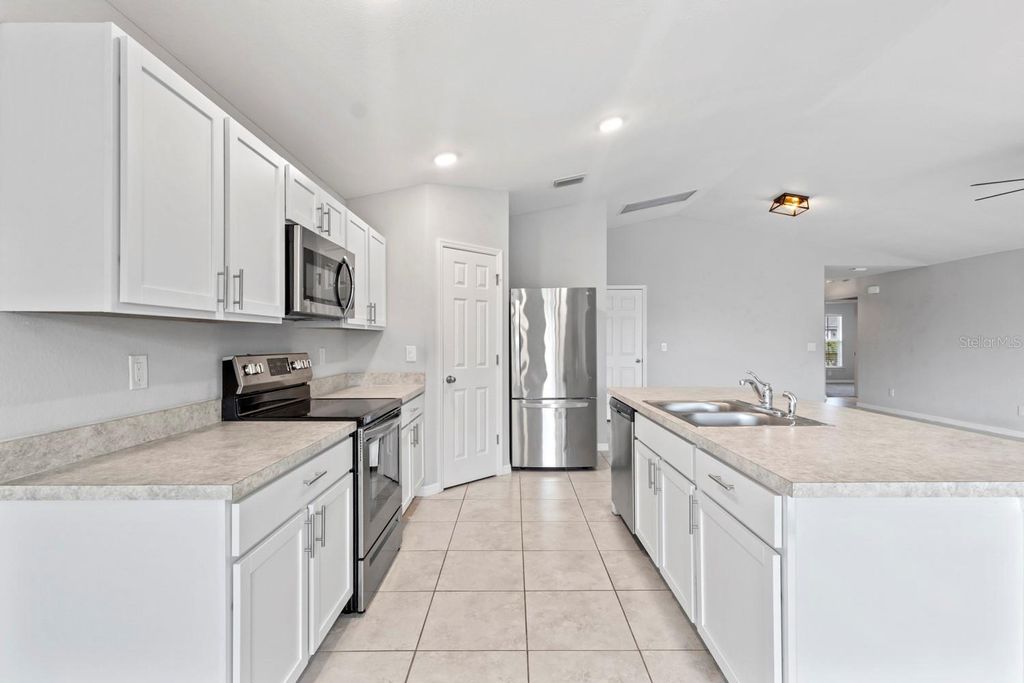 Photo of 1319 NW 14th Place, Cape Coral, FL 33993 (MLS # C7524864)