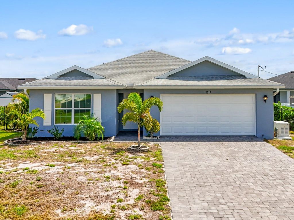 Photo of 1319 NW 14th Place, Cape Coral, FL 33993 (MLS # C7524864)