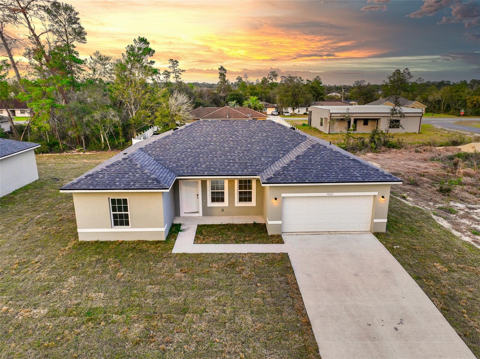 One or more photo(s) has been virtually staged. Discover the perfect blend of comfort and style in this brand-new home situated in the heart of Ocala. Boasting 4 bedrooms and 2 bathrooms, this residence offers a spacious and open concept floor plan, providing a seamless flow between the living room, dining area, and a well-equipped kitchen. The kitchen features an inviting island, a convenient breakfast bar, elegant cabinets, and granite countertops that effortlessly tie into the family room. Whether you're entertaining guests or enjoying a quiet family dinner, this home is designed to cater to your lifestyle. Ocala offers a unique blend of urban amenities and natural beauty, making it an ideal place to call home. Schedule your visit today and make this house your own!