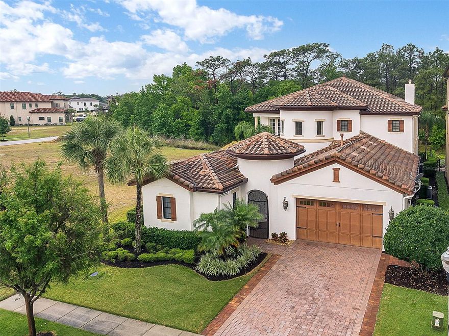 Located in the heart of Reunion Resort, this fully furnished 5,917 sq ft luxury Mediterranean residence boasts a grand entrance, defined by its iron-gated rotunda and striking 9-foot arched door. Inside, a chef’s dream kitchen awaits, complete with granite counters, top-tier appliances, and dual sinks. The property showcases three master bedrooms – the main house hosts two, while a separate casita/in-law suite offers the third. The expansive living space is anchored by a two-story gas fireplace, perfect for evenings of relaxation. For entertainment, the state-of-the-art home theater with its 4K projection offers a cinematic experience. Outdoors, the west-facing deck with a 2-story privacy screen enclosure offers unparalleled views, accompanied by a gas-heated pool and spa, a contemporary outdoor kitchen, and an additional outdoor gas fireplace for a touch of warmth. This property is minutes away from Disney World and Orlando’s top attractions, making it an ideal investment for a short-term rental or vacation home. Schedule your private showing today! Resort membership available. Please inquire.