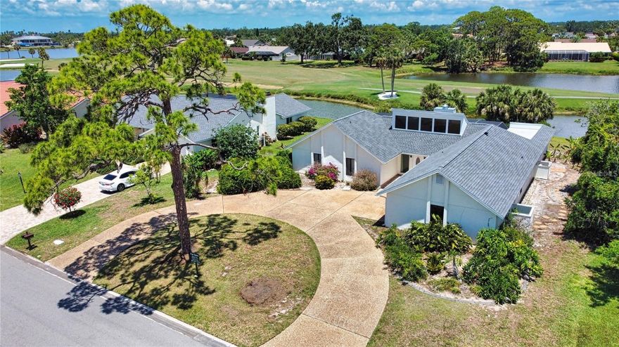 One or more photo(s) has been virtually staged. Set behind the gates of Country Club of Sarasota, this home offers a rare blend of privacy, views, light, and calm in one of Palmer Ranch’s most established and charming communities. From the moment you arrive, the setting feels peaceful and spacious, with mature tropical landscaping, distinctive architecture, and a sense of quiet separation that is getting harder to find in Sarasota.

Inside, the home feels warm, bright, and inviting, with vaulted ceilings, abundant natural light, solid wood doors, and character-rich trim details that give the space a sense of personality. The living areas open naturally toward the screened pool and lanai, keeping the water, golf course, and sunset views connected to everyday life. It is the kind of home where the best moments may happen from a lounge chair by the pool, watching the sky change over the fairway while birds move through the palms.

The outdoor setting is the true centerpiece. The screened pool area feels private and open at the same time, with wide views, peaceful surroundings, and natural screening between the home and the golf course. Whether you are enjoying morning coffee, hosting, spending time outdoors, or winding down at the end of the day, the backdrop gives the home a relaxed Sarasota feel that cannot be manufactured.

The home also offers several confidence-building improvements already in place, including a 2025 roof, prior PVC repiping, refreshed pool and screen components, updated entry features, exterior paint, and other meaningful maintenance items. Those updates help support peace of mind while still allowing the next owner to make the home feel fully their own over time.

Country Club of Sarasota is known for its casual elegance, 24 hour guard gated entry, generous homesites, friendly neighborhood feel, and architectural variety. The community does not require mandatory country club membership, making it appealing for those who want a gated golf course setting without being obligated to join a club. The neighborhood borders the TPC Prestancia golf setting, part of the legendary Tournament Players Club Network and home to a history that includes PGA Senior Tour events, Chrysler Cup Tournaments, and American Express Invitational Champions Tour events.

The location makes the lifestyle even stronger. Set within the popular Palmer Ranch area, Country Club of Sarasota places you close to beaches, boating, golf, tennis, shopping, dining, downtown Sarasota, Venice, and I 75. You can spend the day on the sand, meet friends for dinner, explore Sarasota’s boutiques, or enjoy nearby recreation, then return to a calm, private setting that feels tucked away from it all.

For those who value sunset views, privacy, security, natural beauty, and a warm home in a well maintained gated community, this is a special opportunity in Country Club of Sarasota.