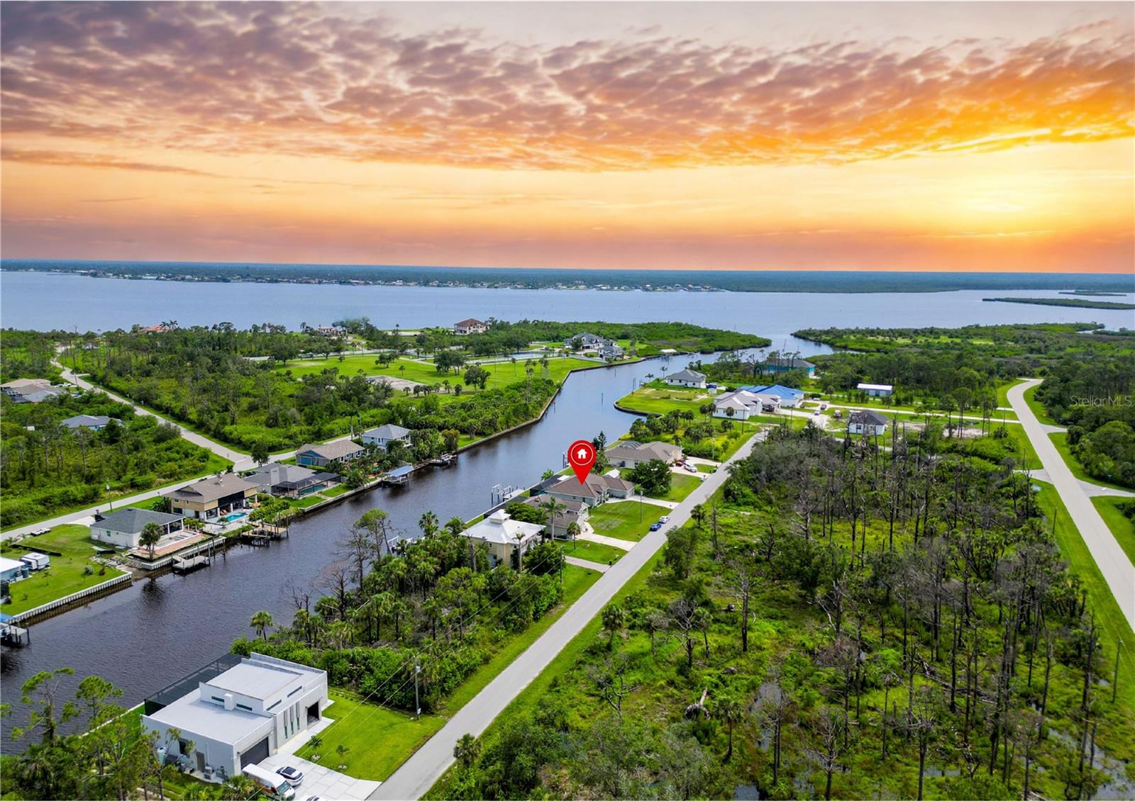 One or more photo(s) has been virtually staged. Price improvement !! Built in 2021 by Adams Homes and loaded with upgrades from front to back, this 4 bed, 3 bath stunner is perfectly set up for the boating lifestyle you’ve been dreaming of.
Sitting on a canal with direct access to the Myakka River and open Gulf waters, the home’s rear faces northwest, while the front faces southeast — making for ideal sunrise coffee views and sunset poolside vibes. It comes complete with a $35,000 private boat dock and 10,000 lb lift, giving you waterway freedom right from your backyard — no pesky HOA telling you otherwise.
Inside, you'll find a split floor plan with a flex room, tray ceilings, $20,000 in upgraded flooring (no carpet!), and a $6,000 water softener system already installed. Step outside to your $100,000 outdoor oasis featuring a 2-year-old screened-in saltwater heated pool / spa and lanai, plus a fully plumbed covered outdoor kitchen, with a covered seating area with a wall mounted TV — perfect for entertaining or unwinding Florida-style.
With its decorative tile roof, lush landscaping, and slightly elevated position, this home brings serious curb appeal and has stayed high and dry during recent storms despite being in a flood zone — no flooding or storm damage here.
Whether you're a weekend boater, serious angler, or just want to live the salt life — this home checks all the boxes.
Opportunities like this on the waterway don’t come around often.
Claim your piece of the Florida lifestyle — before someone else does.