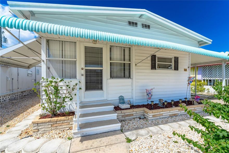 Welcome to Fair Lane Acres, an active 55+ land owned community close to all Bradenton & Sarasota has to offer! This adorable 2 bedroom, 2 bath double wide home has all the charm of a little beach cottage. It has an open concept floor plan with laminate flooring throughout. The kitchen features white appliances, tile backsplash with complementary aqua cabinets. The Florida room gives you that additional sqft and is a perfect little spot to relax the day way. The bedrooms are spacious in size and feature custom built-in cabinetry. There is covered carport & additional shed for your toys.  You are walking distance to all the wonderful amenities! There is also a community swimming pool, shuffleboard courts, pickle-ball courts, Tennis court and a clubhouse with activities. The HOA fee of $132/month also includes water, sewer & amenities. The community is located near SRQ airport, UTC shopping & dining, golfing and is only a short distance to Bradenton Beach & 15 minutes to Anna Maria Island’s Gulf beaches.. Come have your slice of paradise!