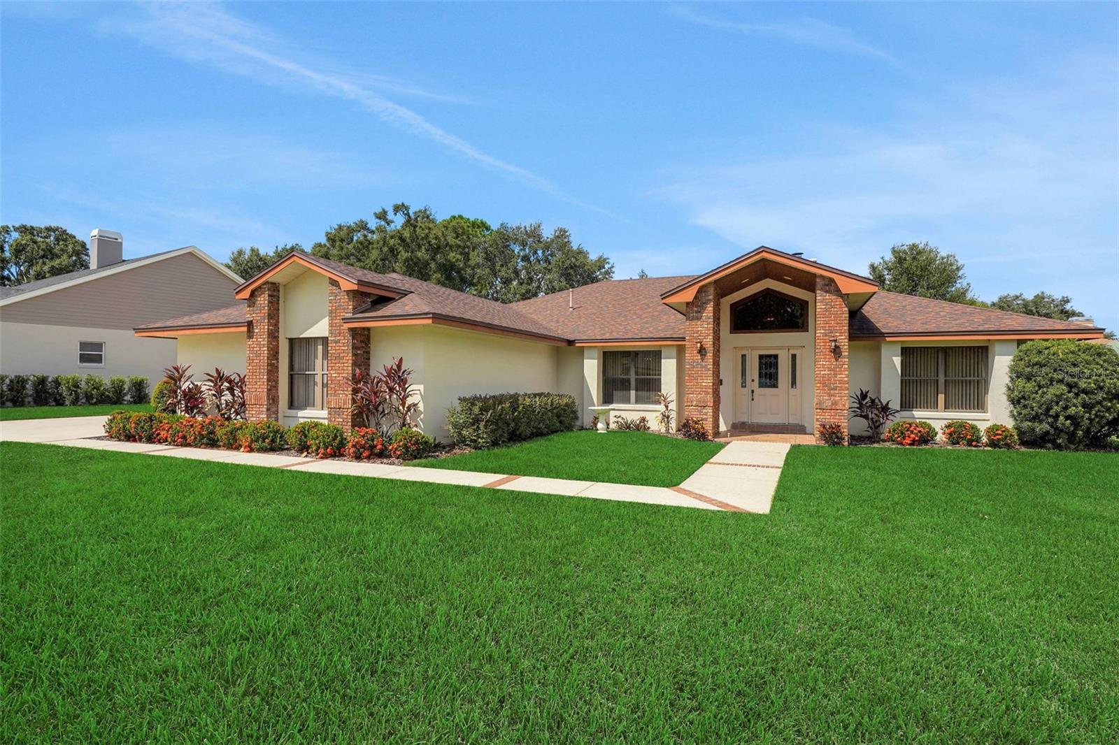 BEAUTIFULLY MAINTAINED, ONE OWNER POOL HOME IN DESIRABLE CYPRESSWOOD GOLF & COUNTRY CLUB PLANTATIONS!!! The Plantations is known for its charming setting, large lots, mature landscaping, friendly neighbors and peaceful streets to walk or bike ride! The entry into Cypresswood is manned with a 24hr security guard. You will want to call this property "home" the moment you arrive in the driveway with the oversized 3-car, side-load garage with ample parking for multiple vehicles and the garage interior is flanked with built-in cabinets. This property boasts the perfect split bedroom floor plan. The primary suite is large and has access to the pool, spa & lanai with brick pavers. An en-suite bathroom features a walk-in shower, separate jetted tub and loads of great closet space. The spacious kitchen is "the heart of the home" and positioned perfectly for enjoying all of the action as it overlooks the large island, granite bar, breakfast nook, pool & family room. The family room is massive with vaulted ceilings and cozy brick fireplace. The sliding glass doors lead to a screened lanai with brick pavers and a huge sparkling swimming pool, spa, wet bar & awesome entertaining areas! You will experience incredible outdoor living in this home! There is room for everyone with a large dining room and separate "flex" space for an office, gym or separate living room. There are so many "extras" in this home! Newer roof in 2019, newer gas hot water heater, central vac, skylights, pool bath, walk-in closets, indoor laundry room, utility sink and a "skeeter beater" protector in the garage! Truly one-of-a-kind, come see how beautiful it is to live in Cypresswood Golf & Country Club! Enjoy golf, tennis, pool, pickleball, fitness center & clubhouse with restaurant & so convenient to shopping, LEGOLAND, restaurants, medical and all of the Central Florida attractions! Call us today for your private viewing!!!