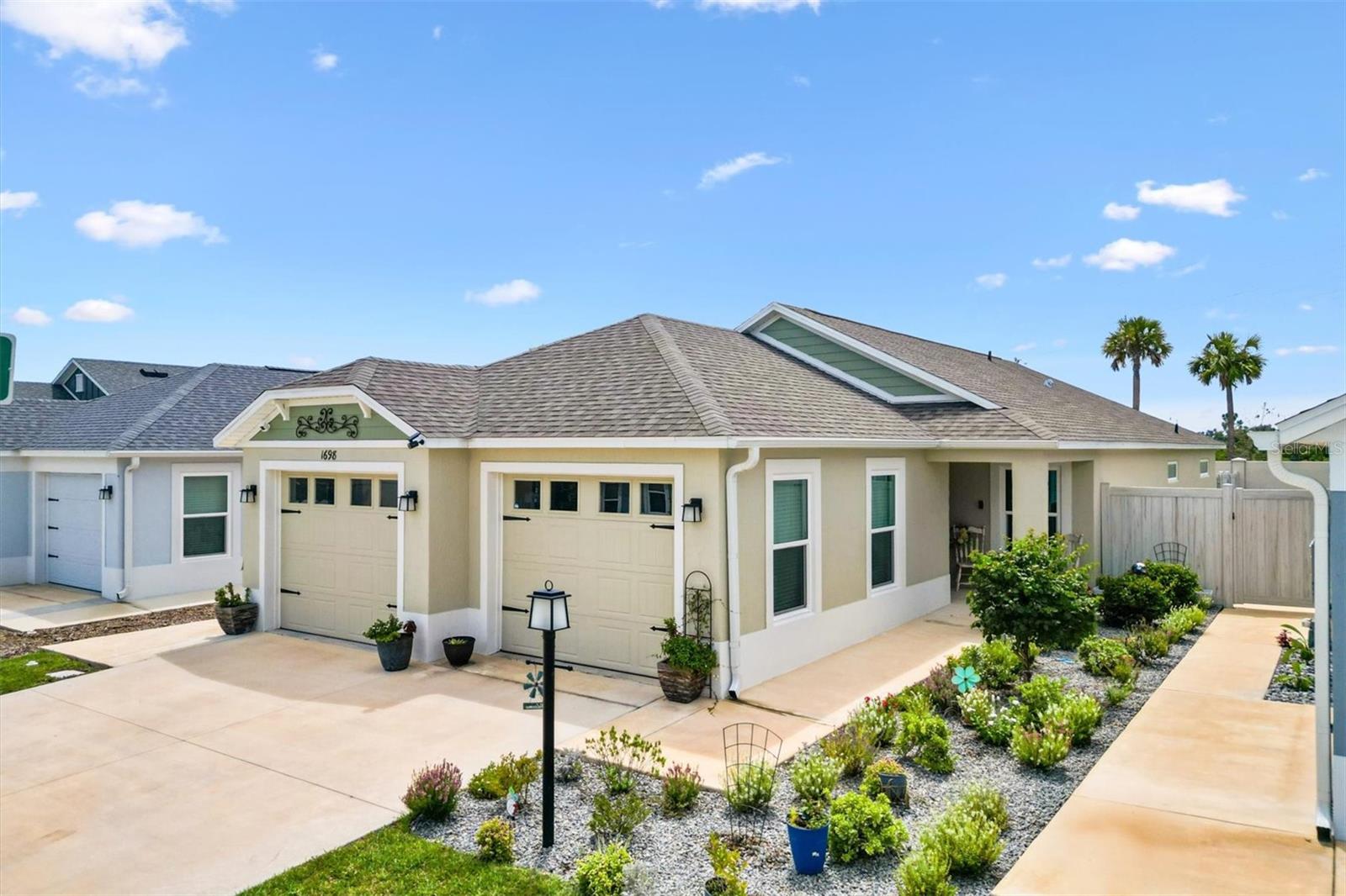 Welcome to this beautifully appointed courtyard villa, where low-maintenance living meets modern design and the unbeatable lifestyle of The Villages®. Every feature of this home has been carefully selected to offer comfort, style, and functionality—an ideal choice whether you’re looking for a seasonal retreat, a year-round residence, or an investment property.
Luxury vinyl plank flooring flows gracefully through the main living and wet areas, offering the look of hardwood with easy-care durability. The bedrooms are carpeted for a warm, inviting feel underfoot, creating the perfect spaces to unwind. The kitchen is a showstopper with crisp white cabinetry, sleek quartz countertops, and stainless steel appliances, including a gas stove that will delight any cooking enthusiast. The open-concept floor plan connects the kitchen, dining, and living spaces, creating an effortless flow that’s ideal for entertaining friends or enjoying quiet evenings at home. A convenient interior laundry area keeps household chores tucked away, while the full two-car garage provides plenty of room for vehicles, golf carts, and storage.
Step outside to your private, fenced courtyard yard—a perfect spot for morning coffee, evening barbecues, or a safe space for your pets to play. The villa’s design offers just the right balance of privacy and accessibility, giving you your own oasis while remaining close to all the amenities The Villages® has to offer.
The location is exceptional. Just minutes away is Sawgrass Grove, one of The Villages®’ most vibrant destinations, known for its live entertainment, unique dining options, and lively atmosphere. You’re also a short golf cart ride to Eastport, the newest downtown, offering exciting new restaurants, shopping, and entertainment venues. Beyond these hotspots, The Villages® lifestyle surrounds you with championship golf courses, pickleball courts, recreation centers, pools, walking trails, and over 3,000 clubs and activities to match every interest imaginable.
This villa is more than just a home—it’s your gateway to the active, social, and carefree lifestyle that has made The Villages® Florida’s premier 55+ community. With modern finishes, thoughtful design, and a prime location near the newest downtown areas, this property is ready to welcome its next happy owner.
Access to the turnpike is literally within 5 minutes, so for all of you that need to get to Orlando for Disney, maybe one of the other theme parks or the Orlando airport this home is more than convenient. Come check it out!
