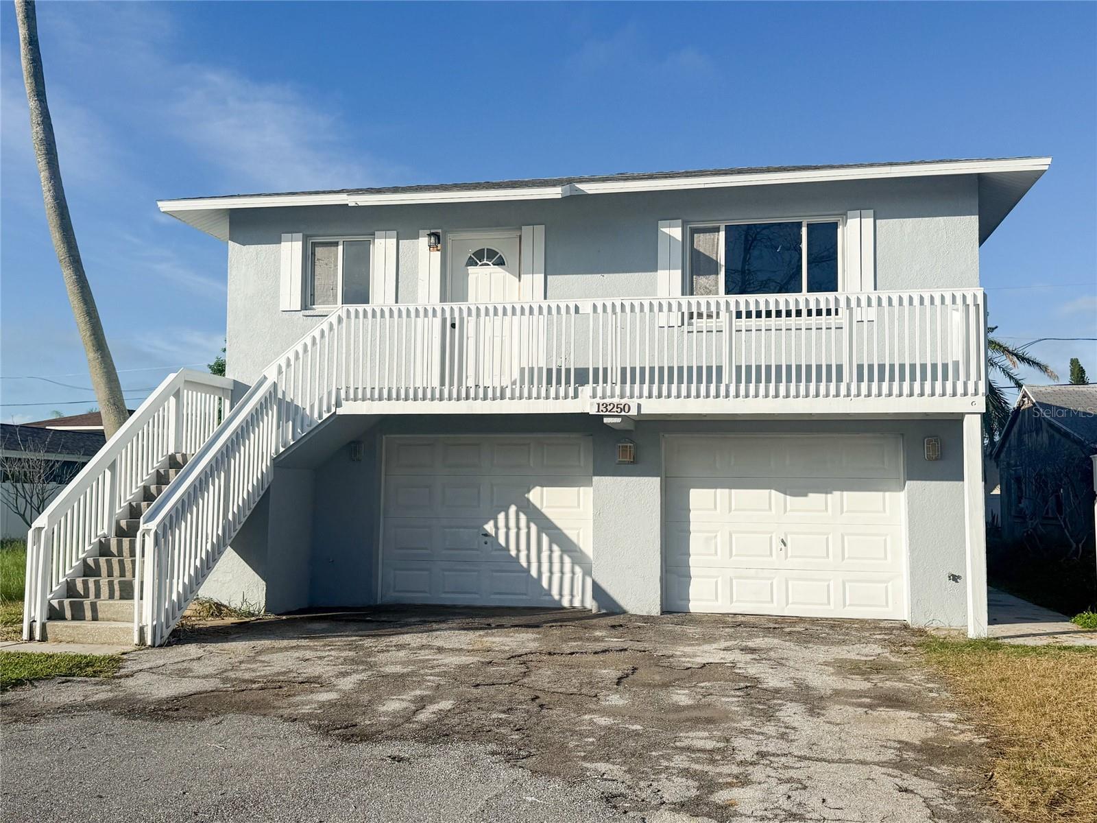Location, location, location! Lovely 2 bedroom, 1 bath home with large rooms which is rare in Madeira Beach that is 4 blocks to the beach, across the street from the intercoastal pocket park and 6 blocks to John's Pass. The home is elevated so no worries about flooding. Inside hook-ups for a washer and dryer. Refrigerator, range, microwave and dishwasher are included. Freshly painted inside and out. There is a large deck out out back for you to sit on to enjoy privacy. There is an option for a garage for $200 per month. Water, sewer and trash collection is included in the rent saving you almost $200 a month! No application fee! The lease is for one year. We require 1st, last and security. This unit will not last long, so call to schedule your showing today!