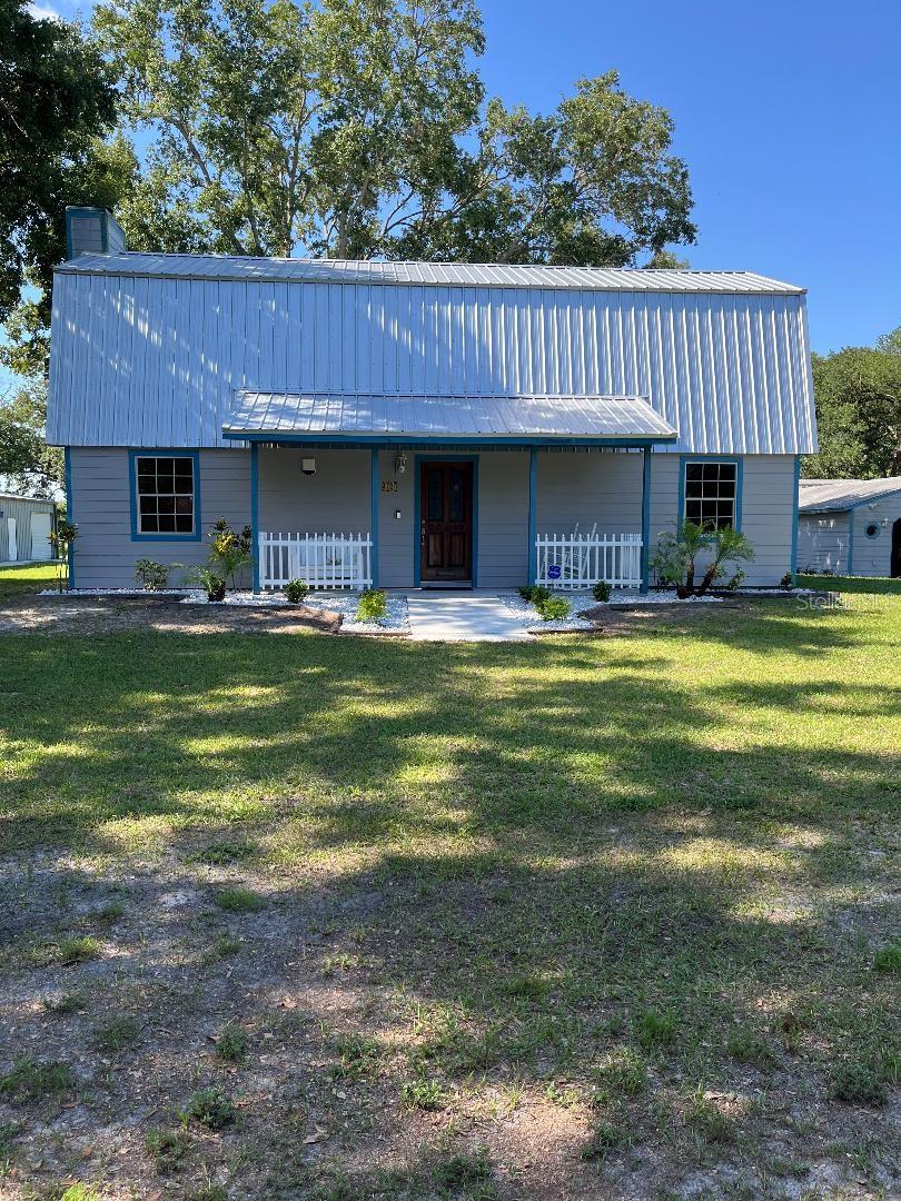 Great location for this 3 bedroom, 2.5 bath on almost an acre, close to attractions, restaurants and shopping, move in ready condition. Boasting high ceilings in living area with wood burning fireplace for those cool nights. Large main bedroom with skylights, onsuite bath offers double sink vanity, large jetted tub with separate double headed shower. Kitchen recently remodeled, metal roof is 1 year old. Seller is an antique car enthusiat and property offers 5 garages which would house approximately 13 cars, many car shows in the area including Old Town & Margaritaville. Main garage has office space and built in safe, another offers a 2 post lift and professional tool box, also RV carport parking. Mature landscapping with large oak trees compliment the large yard with decking and outdoor shower. Relax in the serenity garden with a cool drink after a long days work. Located in county with lower taxes and no HOA fees.