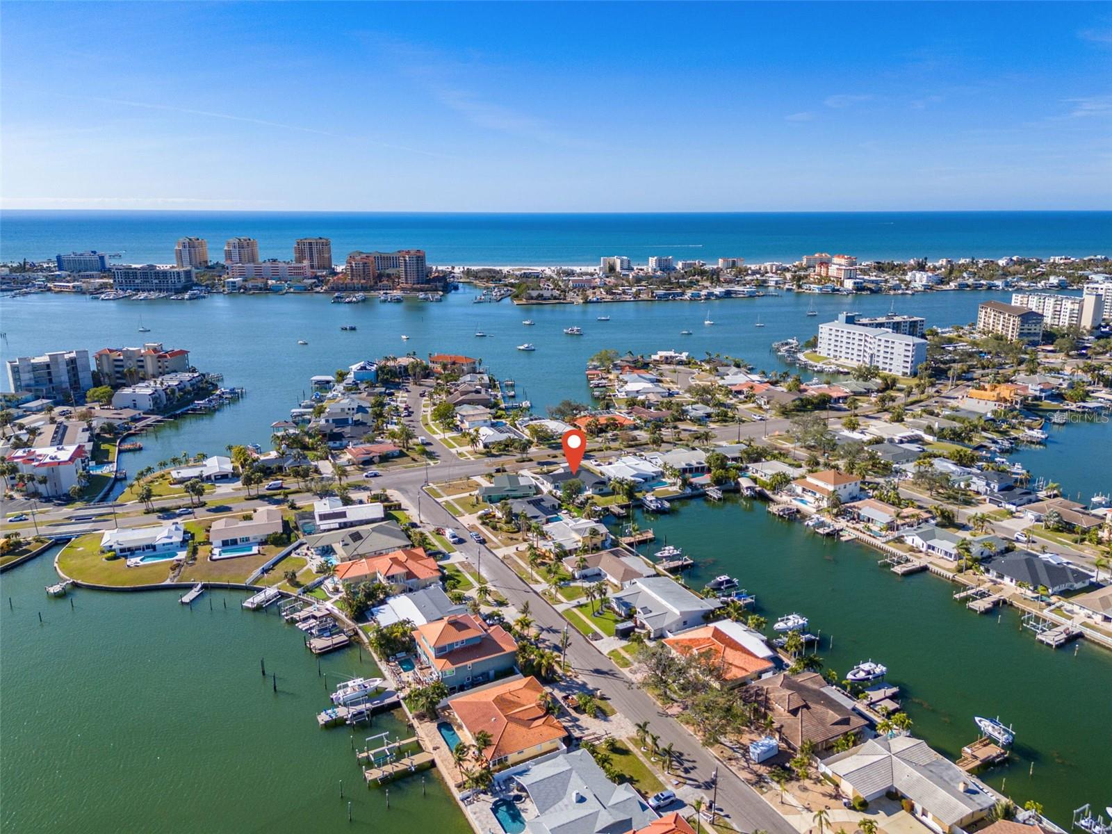 HIGH AND DRY WATERFRONT RETREAT! Standing the test of time, now is your chance to own this beautiful oasis for the first time ever since it was built! This incredible estate has been enjoyed and lovingly cared for by the same family since it was built until now. Per the sellers, this fortress has remained solid, high and dry with no flooding inside this home -- EVER. This beauty blends sleek modern design with Scandinavian elegance, offering luxurious waterfront living in a prime location. Situated on sailboat water with direct, bridge-free access to Boca Ciega Bay, this property is perfect for boaters and water enthusiasts. The solid block construction provides durability and peace of mind, while the open-concept layout and modern finishes create a bright, airy interior. Every detail of this home has been thoughtfully updated, including engineer hardwood floors, NEW ROOF, NEW HVAC and ductwork, HURRICANE IMPACT WINDOWS, bathrooms, water heater, paver driveway. The chef in your life will beam with pride at their new modern kitchen with ample cabinet and quartz countertop space — perfect for cooking up a storm with all the entertaining you’ll be doing! Better yet, the home has DOUBLE master suites, and every bedroom has a bathroom. This home is truly a gem. Outside, enjoy a sparkling pool surrounded by a stylish outdoor living area, perfect for relaxing or entertaining. The private dock offers easy access to open water, making this home ideal for those seeking a waterfront lifestyle. Located just minutes from pristine beaches, shopping, and dining, this home combines convenience with tranquility. With no history of flooding at all per the seller, it offers added security and long-term value. This is a rare opportunity to own a fully updated, move-in-ready waterfront retreat. Schedule your tour today.