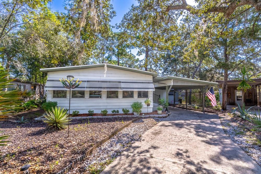 Spacious 2BR/2BA Home in The Forest 55+ Community – Lake Mary’s Best-Kept Secret! Welcome to this warm and inviting 2-bedroom, 2-bath home located in The Forest, Lake Mary’s premier 55+ gated community with low HOA dues that include Cable, Internet and Trash Pickup. This spacious home sits on a cul-de-sac and offers a wonderful blend of comfort, functionality, and privacy. Step inside from the light-filled, air-conditioned Florida room, which adds to your living space year-round. The home features a large open living and dining area, perfect for entertaining, and a generous kitchen with plenty of workspace and storage. The primary bedroom is oversized, with a beautifully updated en-suite bath. The guest bathroom is also updated and thoughtfully designed. Enjoy your morning coffee in the cozy screened porch just off the master bedroom, offering a quiet spot to relax. The large workshop-style shed off the carport includes a utility sink and washer/dryer. With a long driveway, there’s plenty of parking for multiple vehicles or even a golf cart. This home is filled with natural light, thanks to numerous windows and its cheerful, warm interior colors. The roof is just one year old, offering peace of mind for years to come.
Community Features: The Forest is walkable to Publix, Target, HomeGoods, TJ Maxx, restaurants, and only 1 mile to I-4. The Seminole Wekiva Trail is just outside the gate—perfect for walking or biking. The amenities are second to none:
• Architecturally stunning clubhouse with floor-to-ceiling windows, a stage, kitchen, and rental availability for private events
• Two pools—one Olympic-sized, the other heated year-round
• Hot tub, saunas, and locker rooms
• Separate activity building with:
o Billiard room
o Poker room
o Library
o Craft room
o Resident laundry
o Large gathering/game room
•
• Shuffleboard courts, tennis/pickleball court with scheduled events
• Golf cart-friendly community
• Social calendar with weekly and monthly activities
• Onsite office and RV/boat/trailer storage available for a low one-time fee (first come, first served)
If you’re looking for a move-in ready home with character and access to one of Central Florida’s most vibrant 55+ communities, this is the one. Don’t miss your opportunity to experience the lifestyle The Forest has to offer!
