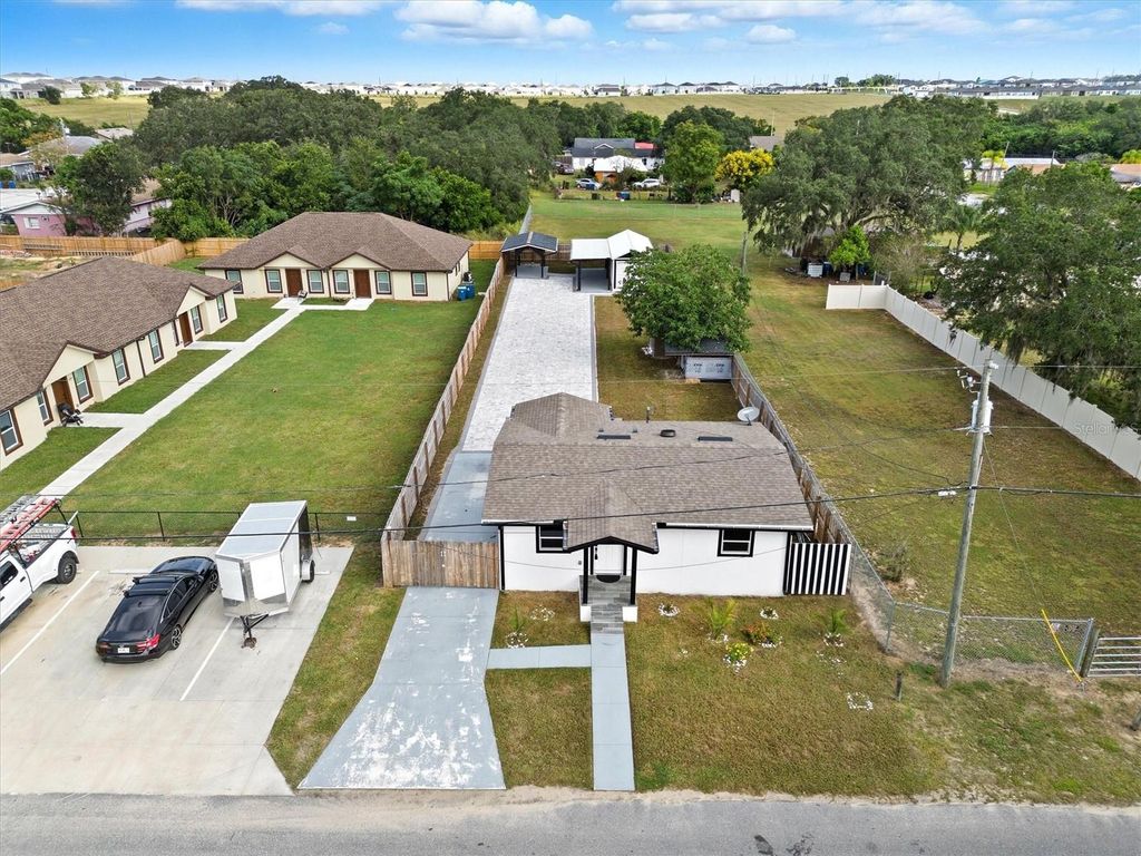 Photo of 414 Monroe Lane, Haines City, FL 33844 (MLS # S5135988)