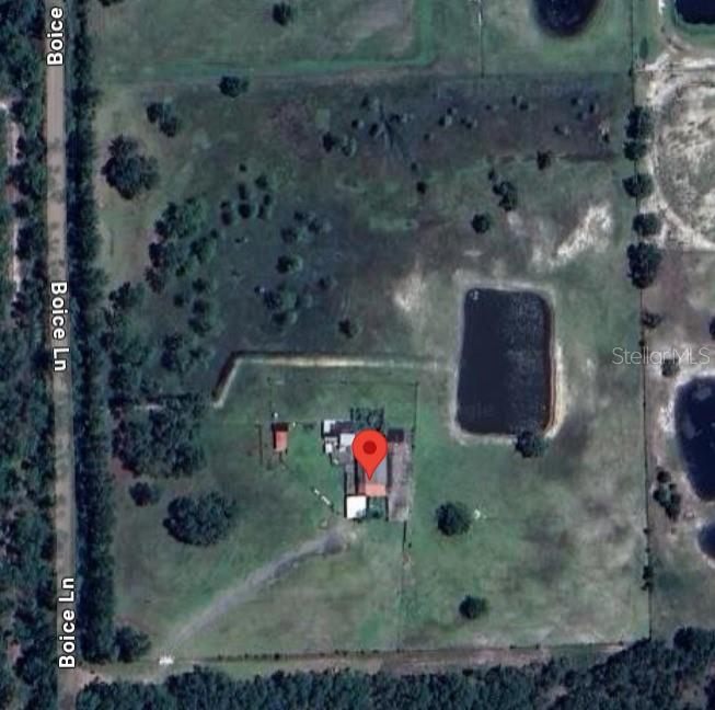 Charming 10-Acre Farmstead in Ormond Beach Welcome to 444 Boice Ln, Ormond Beach, FL—a picturesque 10-acre farm offering the perfect blend of country living and modern convenience. Fully fenced and ready for your agricultural or homesteading dreams, this property is equipped with everything you need to live off the land. The 900 sq. ft. barn features quarters, making it ideal for a guest suite, or farmhand accommodations. Enjoy farm-fresh eggs with two chicken coops and an outdoor chicken pen, while the goat pen provides ample space for small livestock. Outdoor living is a dream with a spacious patio and outdoor kitchen, perfect for entertaining or simply soaking in the peaceful surroundings. The property also boasts power, well water, and a scenic pond, ensuring both comfort and sustainability. Whether you’re looking for a hobby farm, a self-sufficient homestead, or a private retreat, this unique property offers endless possibilities. Schedule your showing today and experience country living at its finest!
