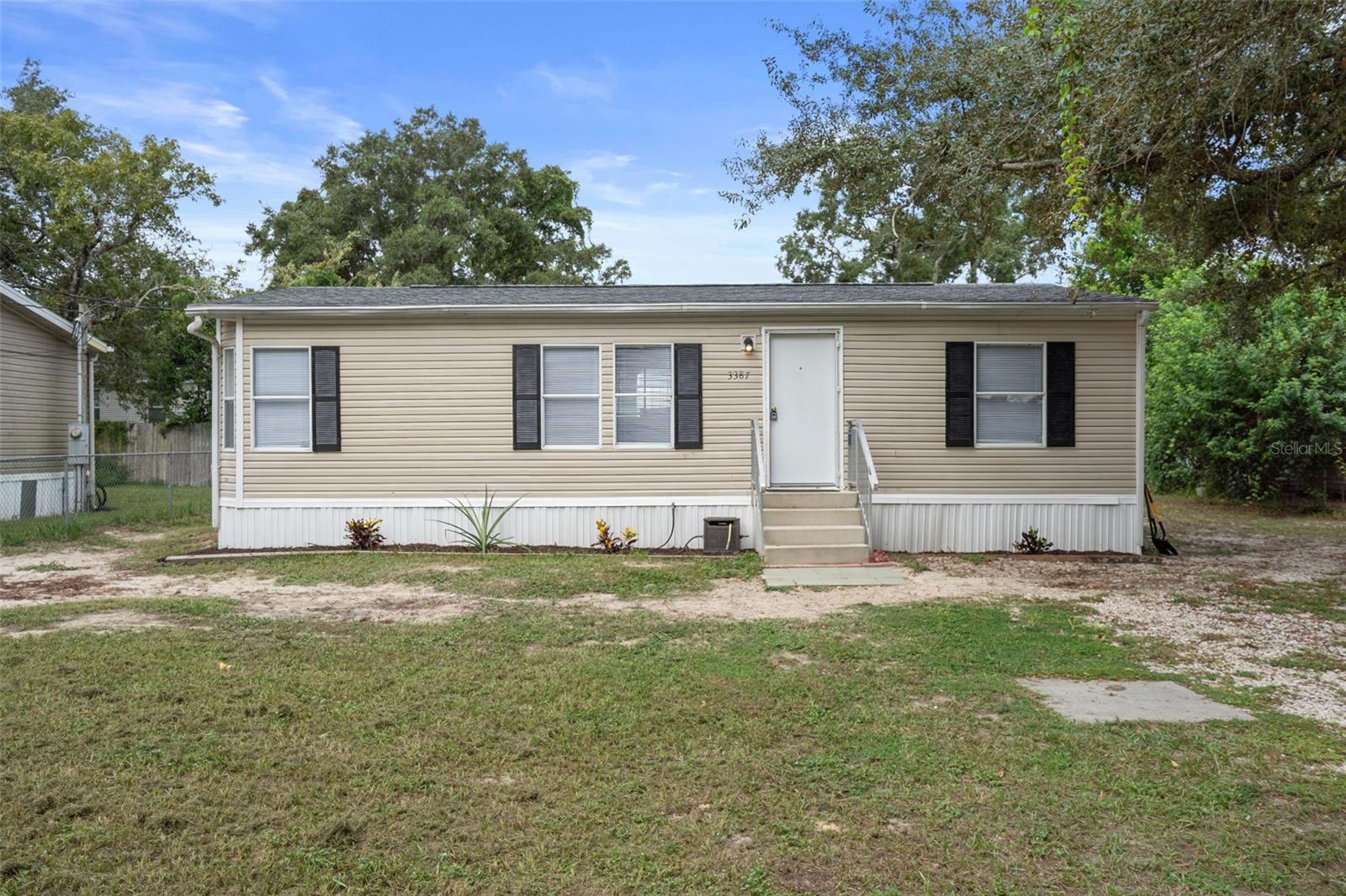 Charming 2 bedroom home ready to move into today. Great property for snowbirds, rental home, first time home, and anyone needing an affordable home. Brand new HVAC installed 9-2025. 2 bedrooms are located on opposite ends. Easy living. You'll love the open kitchen with space for laundry near back exit door. Freshly painted interior and updated exterior. Fenced yard is great for pets. Well water and septic saves you on your monthly utility expenses too! Don't delay, there are few homes available in our market priced under $200k.