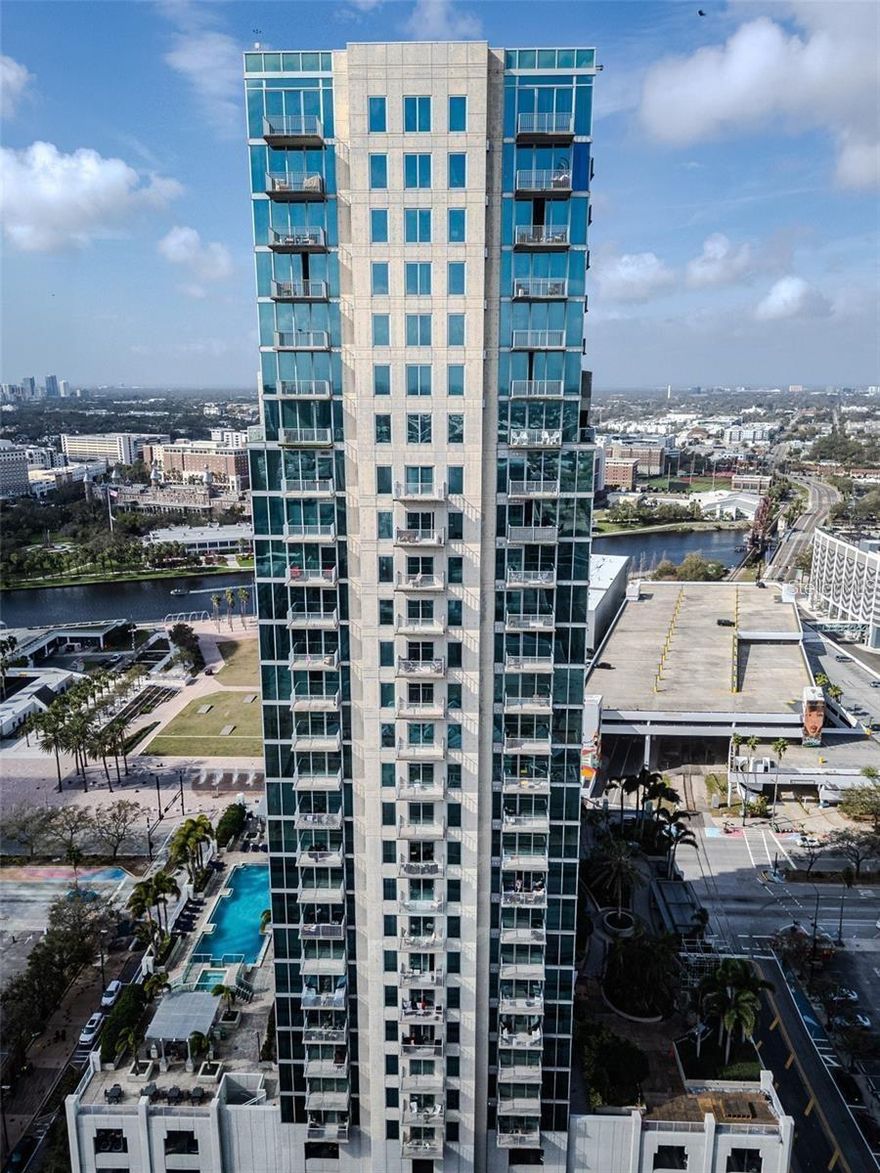 Experience the pinnacle of urban luxury living on the 27th floor of Sky point Condominiums, located in the heart of downtown Tampa. This stunning furnished 2-bedroom, 2-bathroom offers breathtaking views and an unbeatable location, just steps away from Tampa's most iconic attractions. Amalie Arena, Armature Works, the Tampa Museum of Art, Glazer Museum, and enjoy leisurely strolls along the Riverwalk and Curtis Hixon Park. The open-concept layout is flooded with natural light from expansive windows, providing panoramic views of the downtown skyline. The expansive kitchen features sleek stainless steel appliances, perfect for cooking and entertaining. The primary suite boasts floor-to-ceiling windows that frame sweeping views of Tampa, while the attached en-suite bath features a double vanity for ultimate convenience. The second bedroom offers a separate full bath, ideal for guests or a home office. Two secure parking spaces are included, ensuring peace of mind and convenience. Sky point offers a range of exceptional amenities to elevate your lifestyle, including 24-hour concierge service, secure access, a large pool and hot tub, an outdoor grilling station and bar, shaded pergolas, and a beautiful clubhouse with a catering kitchen. Stay fit in the on-site fitness center, which includes a cardio/weight room studio, and a lounge area complete with flat-screen TVs, billiards, and a home theater. Sky point is ideally located near Harbour Island, Channel side, and Tampa General Hospital, with easy access to top restaurants, shops, and entertainment. If you're looking for luxury, convenience, and spectacular views, this is the place to be. Don’t miss out on this exceptional opportunity to live at Sky point — where every detail is designed for your comfort and enjoyment. Weeks and Months Available