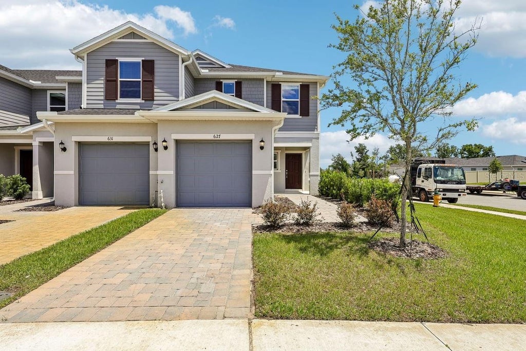 Photo of 627 Meadows Edge Place, Lake Wales, FL 33859 (MLS # O6443298)