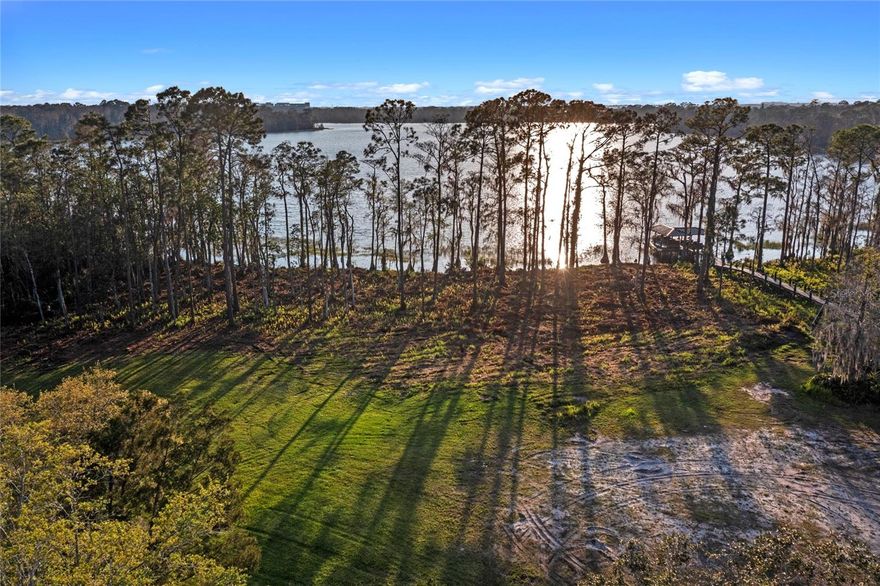 Located along the shores of Buck Lake, this expansive 2.15-acre home site offers serene and sparkling water views. Providing the rare opportunity to be one of the last available home sites with direct access to Buck Lake, this lot features 173 feet of waterfront. Choose this lot and you can select your builder from an array of approved builders in Lake Nona Golf & Country Club. Optional Builder Plans Available Upon Request.