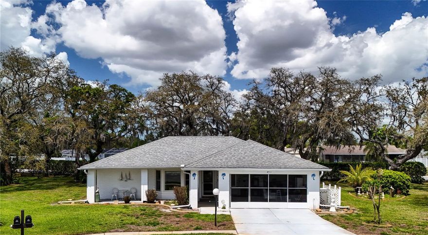 Welcome home to this well-maintained 3-bedroom, 2-bath residence featuring a desirable split floor plan that offers both privacy and functionality. Situated on an oversized lot in a small quiet cul-de-sac, this property provides a peaceful setting. Inside, the home offers a bright and inviting layout with a separate dining area perfect for hosting, along with a comfortable family room just off the kitchen, creating an ideal flow for everyday living. The kitchen is enhanced with updated countertops, adding a modern touch. A standout feature of the home is the large additional 350 sq ft enclosed and cooled Florida room with No rear Neighbors, perfect for year-round enjoyment. Whether used as a second living area, hobby space, or relaxing retreat, it adds valuable square footage and versatility. Additional highlights include new windows that bring in natural light while improving energy efficiency, a convenient inside laundry room, and a spacious 2-car garage complete with a screened doors. Major updates include a roof installed in 2015 and an air conditioner replaced in 2014.Located within a well-maintained 55+ community, residents enjoy access to amenities such as a community pool and tennis courts, offering A low HOA and an active and social lifestyle. This home blends comfort, space, and location, making it a wonderful opportunity to settle into easy Florida living.