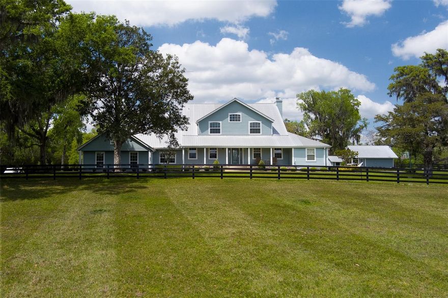 Southern View Farm is a truly remarkable property, conveniently located just 15 minutes from both HITS and the World Equestrian Center. Spanning 63.09 acres, this farm features lush, mature landscaping, a paved driveway, and is fully fenced with 14 well-maintained paddocks. The property is equipped with four barns offering over 24 stalls, including a main center-aisle barn that includes a barn office, an apartment, a bathroom, tack room, feed room, and wash racks. The spacious two-story main residence boasts four bedrooms and three full bathrooms, a large kitchen with updated appliances, and an office. Attached to the home is a well-appointed in-law suite with its own kitchen, one bedroom, one bathroom, and a half bathroom. Additional features include a gym, office space, and a three-car detached garage. Two additional mobile homes on the property each offer three bedrooms and two bathrooms, ideal for guests or staff. Other notable amenities include a climate-controlled RV building with a large roll-up door, water, a septic hookup, and a half bath attached. The property also has irrigation down the driveway, including the beds at the front gate, and the yard around the house is irrigated as well. The large shop has eight bays, two of which are open, with the remaining six enclosed, including one air-conditioned bay. The property also boasts a serene pond with a gazebo, a 150x230 irrigated sand footing arena, an irrigated round pen, feeding stations, and several equipment sheds. Southern View Farm presents an incredible opportunity for equestrian enthusiasts, offering an outstanding combination of functionality and peaceful living!
