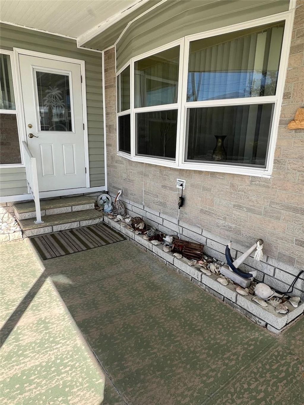 Photo of 37 Pindo Palm Street W, Largo, FL 33770 (MLS # TB8468590)