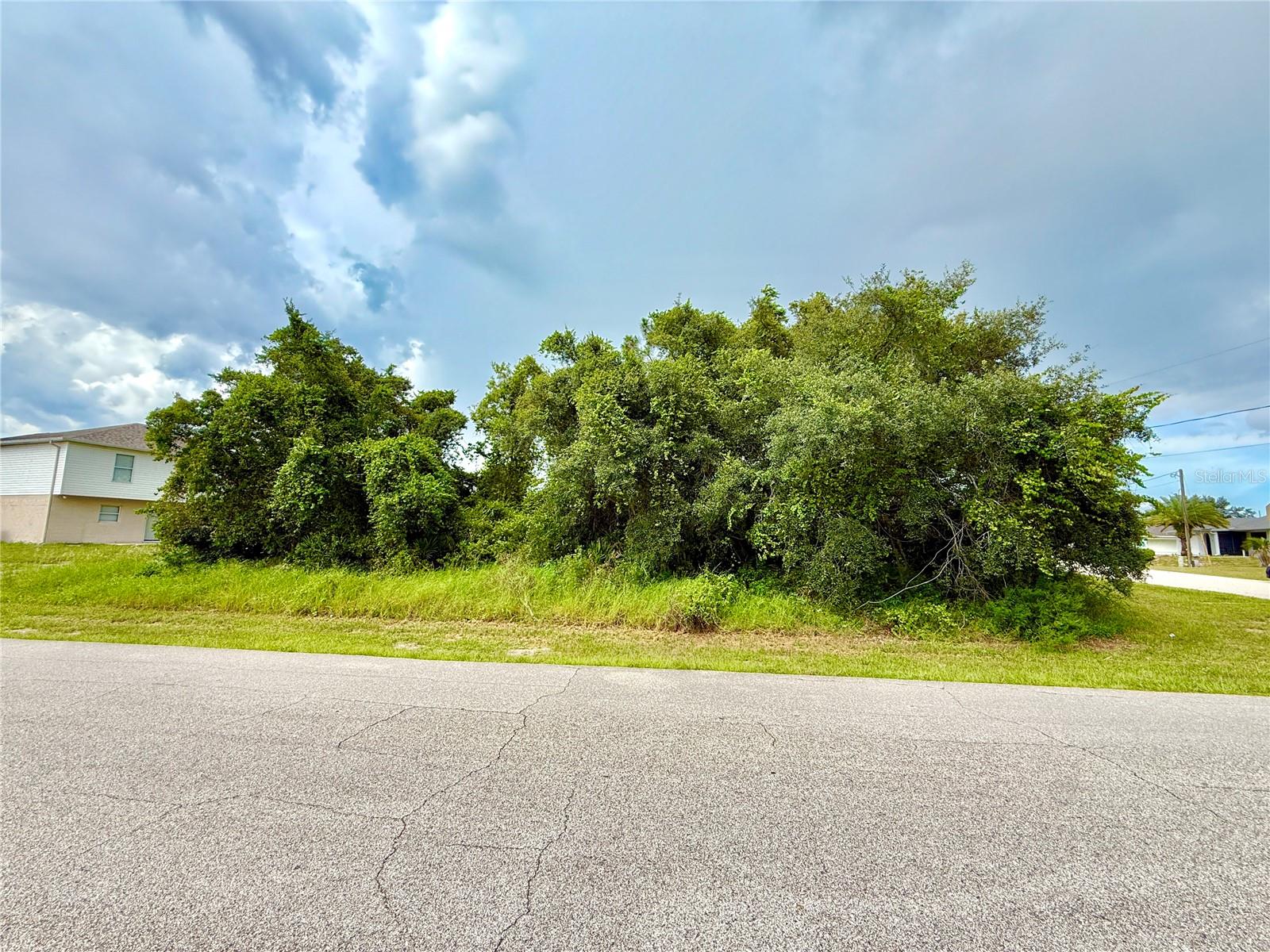 Discover the Perfect Opportunity to Build Your Dream Home or Invest in the Growing Community of Poinciana with This Oversized Corner Lot. This Parcel is Surrounded by Natural Beauty and New Residential Development, Offering both Privacy and Potential. This Residentially Zoned Lot is Ready for your Vision. You’ll Enjoy Convenient Access to Local Amenities Including Schools, Parks and Shopping Centers. Everything You Need is Just Minutes Away! This Lot also Offers Easy Access to Major Roads. LOW Monthly HOA Fee Includes High-Speed Internet and Cable. Whether You're a Builder Seeking Your Next Project, an Investor Looking for Long-Term Value or a Future Homeowner Ready to Bring your Custom Home to Life, This Lot is an Ideal Choice.