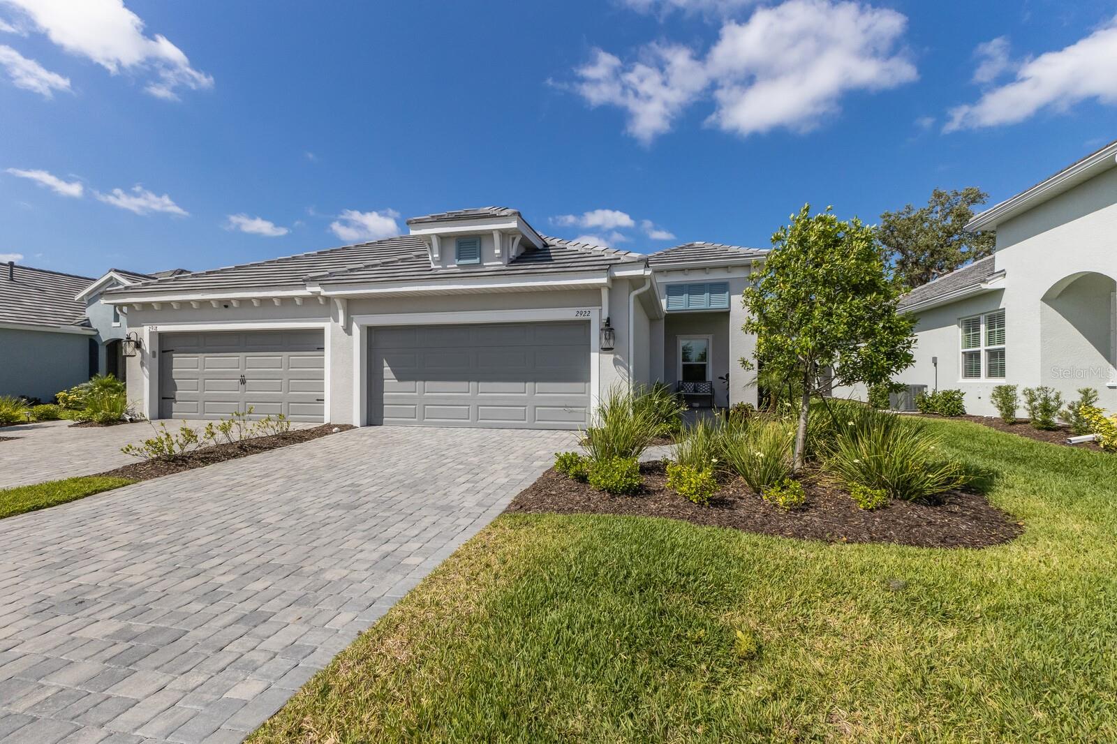 Experience the perfect blend of luxury and comfort in this beautifully upgraded 2-bedroom, 2-bathroom home with a versatile den, available for rent in the sought-after Windward at Lakewood Ranch by Neal Communities. Built in 2023, this nearly new home is tucked away on a quiet cul-de-sac lot with stunning preserve views, offering exceptional privacy, modern finishes, and the option to come fully furnished if desired.
From the moment you arrive, you’ll appreciate the home’s elegant paver driveway, screened-in front porch, and meticulously maintained landscaping. Inside, enjoy a bright and welcoming atmosphere enhanced by coffered ceilings, fresh interior paint, and upgraded lighting fixtures and hardware throughout.
The gourmet kitchen features quartz countertops, a matching backsplash, upgraded cabinetry with crown molding, and sleek new hardware. The open-concept layout seamlessly connects the kitchen, dining, and living areas, perfect for both everyday living and entertaining. Sliding glass doors lead to the extended lanai, where you can relax and take in peaceful preserve views. A gas hookup on the patio adds convenience for outdoor grilling.
The spacious primary suite offers a serene retreat with a spa-like en-suite bathroom. A comfortable secondary bedroom and a flexible den—ideal for a home office or media room—provide versatile living options. The laundry room includes added cabinetry and counter space for storage and functionality, while the garage features epoxy-coated flooring and a utility sink.
Additional highlights include hurricane shutters, a beautifully finished paver lanai, and the option to rent the home fully furnished for added ease and comfort.
Located in Windward at Lakewood Ranch, a gated and pet-friendly community, residents enjoy access to scenic walking trails, a vibrant community center, and resort-style amenities. Landscaping, pest control, and access to all community features are included with the rental.
This exceptional rental home is move-in ready and offers a rare opportunity to enjoy luxury living in a premier location. Schedule your private showing today!