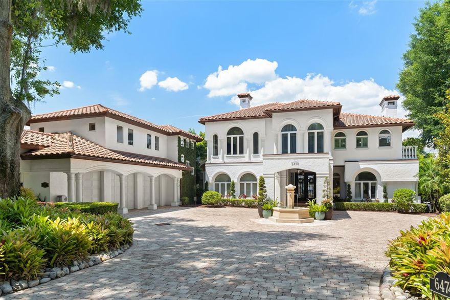 Within the gates of Isleworth, on beautiful Lake Chase among the Butler Chain of Lakes, sits this exquisite estate offering the best of Florida waterfront living. The six-bedroom, five and a half bath home is located adjacent to the driving range and tennis center, and is in close proximity to the renowned Isleworth Golf & Country Club house. Boasting an updated interior spanning more than 5,800 square feet, the estate offers spacious, light-filled rooms showcasing a phenomenal mix of fine finishes which create a home that is chic, stylish and relaxing. From the formal foyer featuring breathtaking views, to the dining room, open kitchen, breakfast nook and large family room, the sprawling floor plan captures exquisite vistas at every turn. The second-floor primary suite overlooks an outdoor oasis with views of Lake Chase, and the primary bath holds an oversized walk-in shower as well as an additional laundry room. Two home offices offer separate workspace options. A private guest suite opening to a kitchenette and loft area conveniently rounds out the additional spaces in the home. Enjoy numerous outdoor dining and lounging areas and summer kitchen, along with the grounds featuring an open-air swimming pool, heated spa and boat dock.