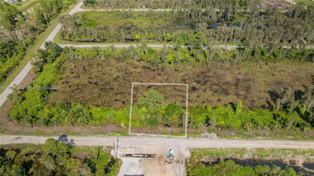 Photo of Belden Ave, Lehigh Acres, FL 33974 (MLS # O6442267)