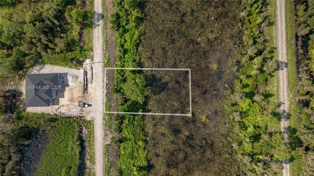 Photo of Belden Ave, Lehigh Acres, FL 33974 (MLS # O6442267)