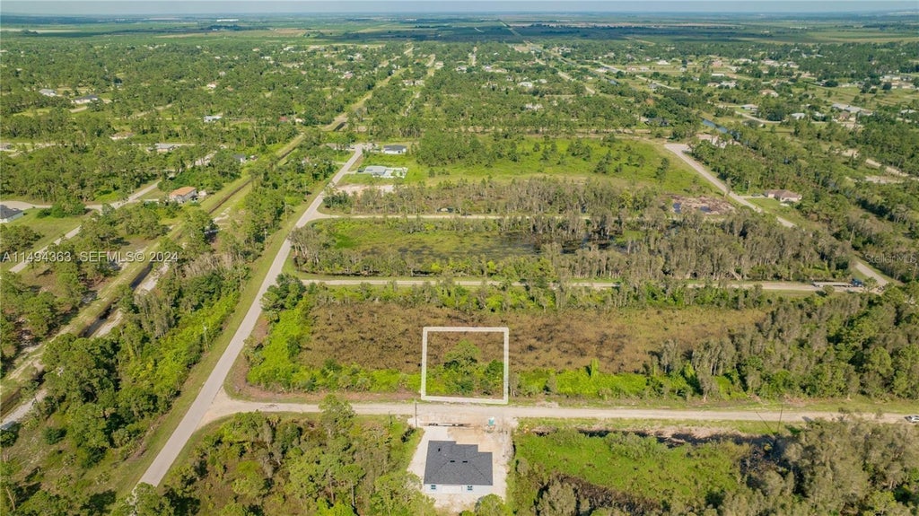 Photo of Belden Ave, Lehigh Acres, FL 33974 (MLS # O6442267)