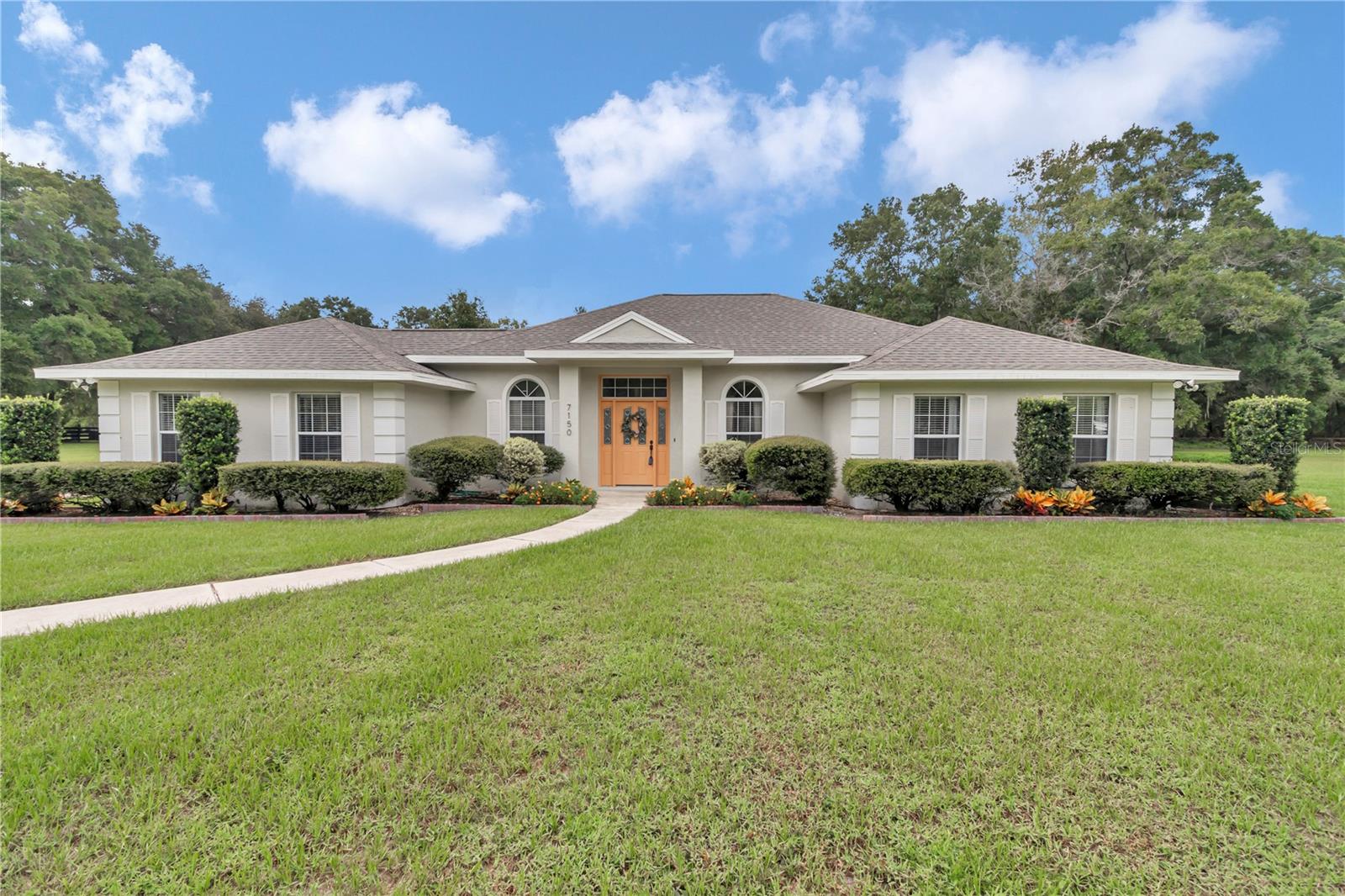 Stunning Pool Home on 3+ Acres in Gated Countryside Farms
Welcome to this beautifully maintained 4-bedroom, 3-bathroom home located in the desirable gated equestrian community of Countryside Farms in SW Ocala. Situated on 3.01 acres, this split floor plan residence offers both functionality and elegance.
The updated eat-in kitchen features Quartz countertops, stainless steel appliances, and a custom barn-door pantry. The spacious great room showcases French doors that open to a screened-in pool and patio—ideal for Florida living and entertaining.
Interior highlights include crown molding, shiplap-accented high ceilings in the main living areas, and a well-appointed laundry/mud room with direct access to the garage and pool area. All bathrooms have been tastefully updated.
Recent upgrades include a new roof (2022), resurfaced pool (2022), updated plumbing, new well pump, and new water heater—offering peace of mind for future homeowners.
Located in an A-3 zoned area, this property permits horses. There's ample space to add a barn, making it a great option for equestrian enthusiasts. Move-in ready and conveniently located near shopping, dining, and local amenities.