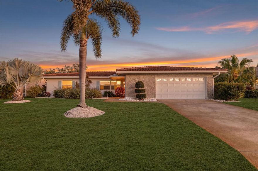 An extraordinary waterfront sanctuary in Venetian Isles—where enduring construction, elevated positioning, and uncompromising design converge to create a residence of exceptional distinction. Set among one of St. Petersburg’s most coveted boating communities, this refined coastal home is a true rarity: one of the very few properties in Venetian Isles that has NEVER experienced water intrusion or hurricane damage. Elevated higher than neighboring homes and constructed of solid block, this residence offers a level of confidence, resilience, and serenity seldom found in waterfront living. Thoughtfully enhanced with high-caliber upgrades throughout, the home blends timeless sophistication with modern performance. The chef’s kitchen is a statement of understated luxury, featuring quartz countertops, a farmhouse sink, bespoke two-tone soft-close cabinetry handcrafted by St. Pete Custom Cabinetry, a Bosch dishwasher, and a premium Thermador appliance suite—including a refrigerator/freezer and a four-burner natural gas range, supported by a newly installed gas line. Designed for seamless indoor-outdoor living, the property’s private dock was comprehensively reimagined in 2023 with new pilings, wrap, steps, decking, and a 10,000-lb boat lift—offering effortless access to Tampa Bay and the Gulf beyond. Whether hosting sunset gatherings or embarking on sunrise cruises, this waterfront setting is both elegant and functional. Modern infrastructure upgrades ensure the home performs as beautifully as it presents, including a new Rheem HVAC system (early 2024) with professionally cleaned ductwork, a 200-amp electrical panel (2022), EV charging post, and impact-rated windows and doors for ultimate peace of mind. The garage rivals luxury showrooms with a MyQ LiftMaster system, impact-rated side garage door (2024), and double epoxy flooring. This residence stands apart as a once-in-a-generation opportunity—a home that offers not only refined waterfront living, but enduring value and absolute confidence. This is Venetian Isles at its most elevated.