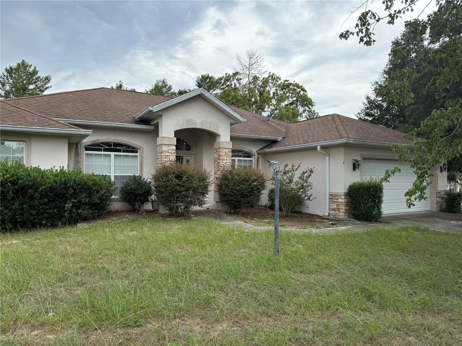 Welcome to this concrete block 3-bed, 2-bath, 2 car garage home located in SW Ocala. Featuring an open-concept layout, formal dining, separate office, spacious living area, modern eat in kitchen w/ island and a split-bedroom floor plan. The primary suite includes a walk-in closet and private bath. Enjoy peaceful evenings on the covered patio overlooking the large backyard. Located just minutes from SR-200, shopping, dining, and medical facilities—this home combines comfort and convenience. **Cash Only. Sold AS-IS. Sale subject to probate and court approval** NOT FOR RENT. NO SITE UNSEEN OFFERS WILL BE REVIEWED OR CONSIDERED.