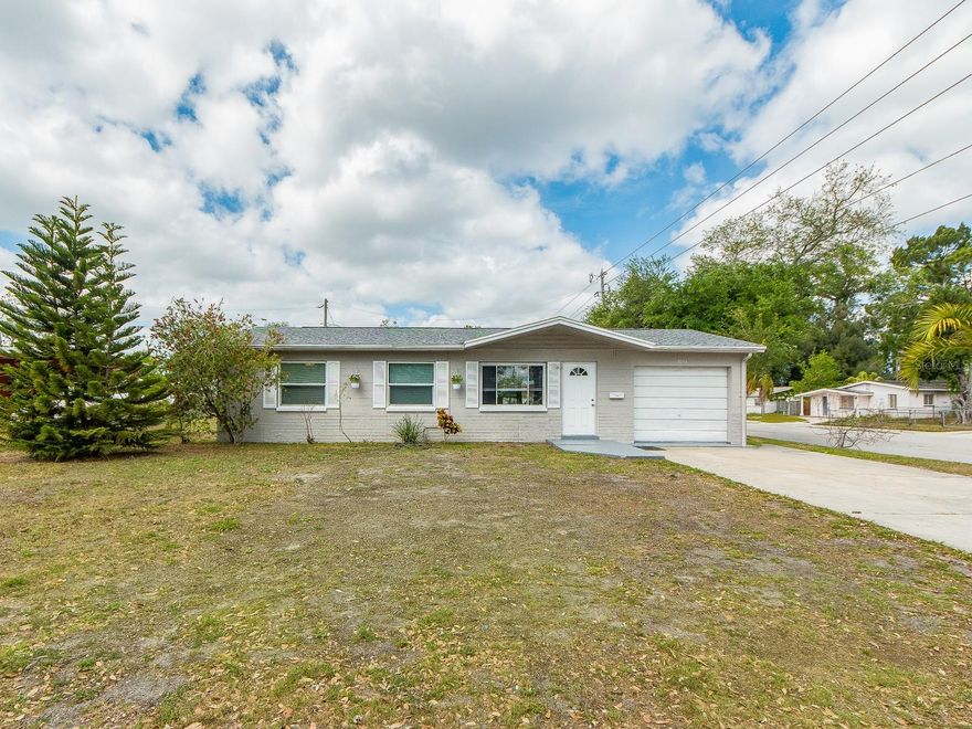 Beautifully maintained 3-bedroom, 2-bath home situated on a desirable corner lot. This light and bright residence features a spacious living room with a versatile bonus area—perfect for a home office, playroom, or additional lounge space.

The updated kitchen offers ample storage and functionality, making it ideal for everyday living and entertaining. Enjoy a separate kitchenette and dedicated dining area for added convenience and flexibility.

Sliding glass doors lead to a large, beautifully screened-in porch—perfect for relaxing or hosting guests year-round. The generously sized primary bedroom easily accommodates a king-size bed and more, and includes a private en-suite bathroom with a step-in shower.

Step outside to a large backyard, offering plenty of space for outdoor entertaining, gardening, or simply enjoying the Florida lifestyle.
Additional highlights include a brand new A/C system (2026), providing peace of mind and energy efficiency. New Roof 2024. 


This home combines comfort, space, and practicality—ready for you to move in and make it your own!