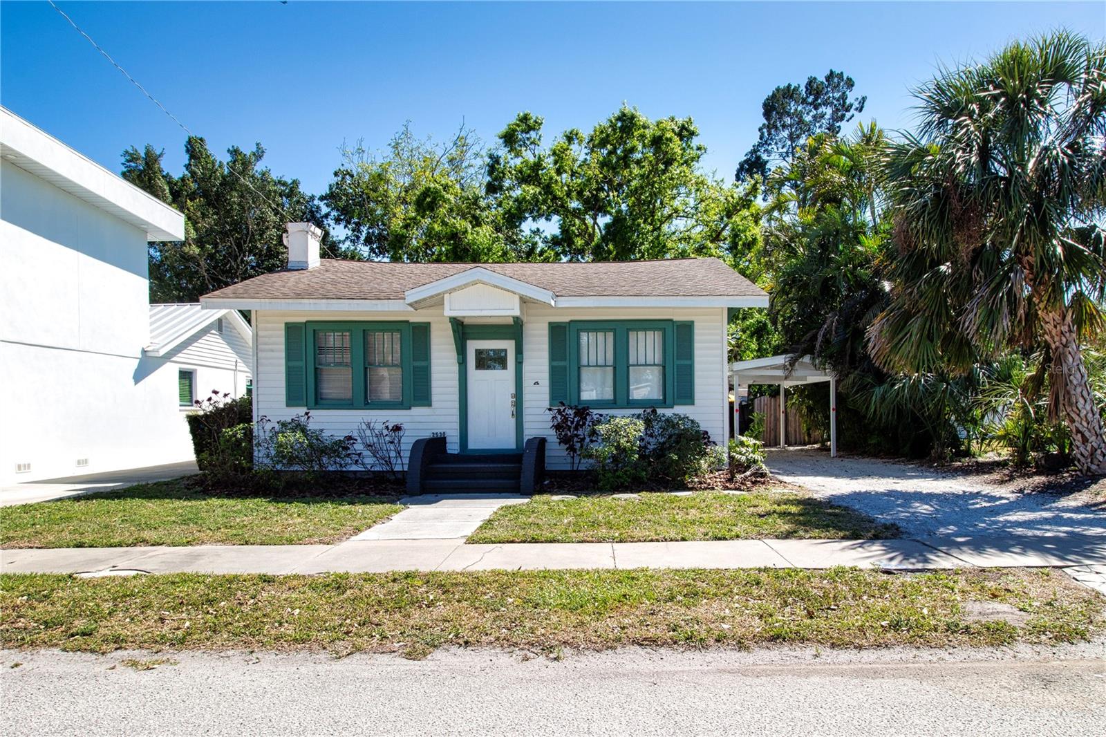 TURNKEY FURNISHED and MOTIVATED SELLER! Ready to move in, reimagine or consider Short Term Rental! Charming 2 bedroom 2 bathroom Florida 1925 craftsman style home. Enjoy all that Sarasota offers from this wonderful central coveted location known as Arlington Park. Top rated school district; less than a mile to Sarasota High School. Close to Bayfront and Centennial Parks for access to Sarasota Bay, and a short drive to Siesta Key Beach, this light filled home maintains historic charm and character with original hardwood floors, several 1900's sash windows, and 10" baseboards. You will enjoy the serene private large shaded deck in the backyard, and the bonus utility of an artists' studio. Down the street, you'll find a walking path to Arlington Community Park which offers tennis, pickleball, a community pool, outdoor gym, basketball courts and dog park. A quiet family friendly neighborhood bikeable to the arts and culture of downtown Sarasota just 2 miles away, with SMH one mile away this neighborhood is trending fast. The 5,325 sqft lot includes a carport and driveway with sidewalk in front. Furnishings set up for short term or furnished annual rental included. This is an opportunity to own a piece of history with modern comforts and income-generating potential.