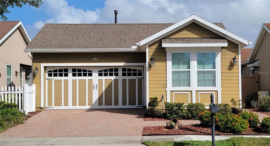 Welcome to resort living in Trilogy of Orlando! This Villa is perfect for care-free living full time, or for those who want to Winter in Florida. This two bedroom, two bath home and a den, is the perfect size for just that. Plus, you have a great outdoor space with screened lanai and wrap around side private courtyard as well. Loaded with upgrades including solar, wood floors, tankless water heater, upgraded kitchen cabinets with under counter lighting, stainless steel appliances, new microwave, and 5 burner gas range with griddle. And, if you don't feel like cooking in that fabulous kitchen, you can enjoy a meal Wednesday-Sunday at the Grille Restaurant & Bar, located in the 57,000 square foot state-of-the-art Clubhouse. Amenities include an Athletic Club with top-of-the-line equipment, resort-style indoor/outdoor pool, heated spa, ladies & men's locker rooms with lockers, showers, etc., pickleball and tennis courts, bocce ball, billiard room, poker room, craft room, and so much more. There is always some type of entertainment, concerts, and fun entertainment planned for the community. You will feel like you are always on vacation!! Come live the good life at this tropical oasis!