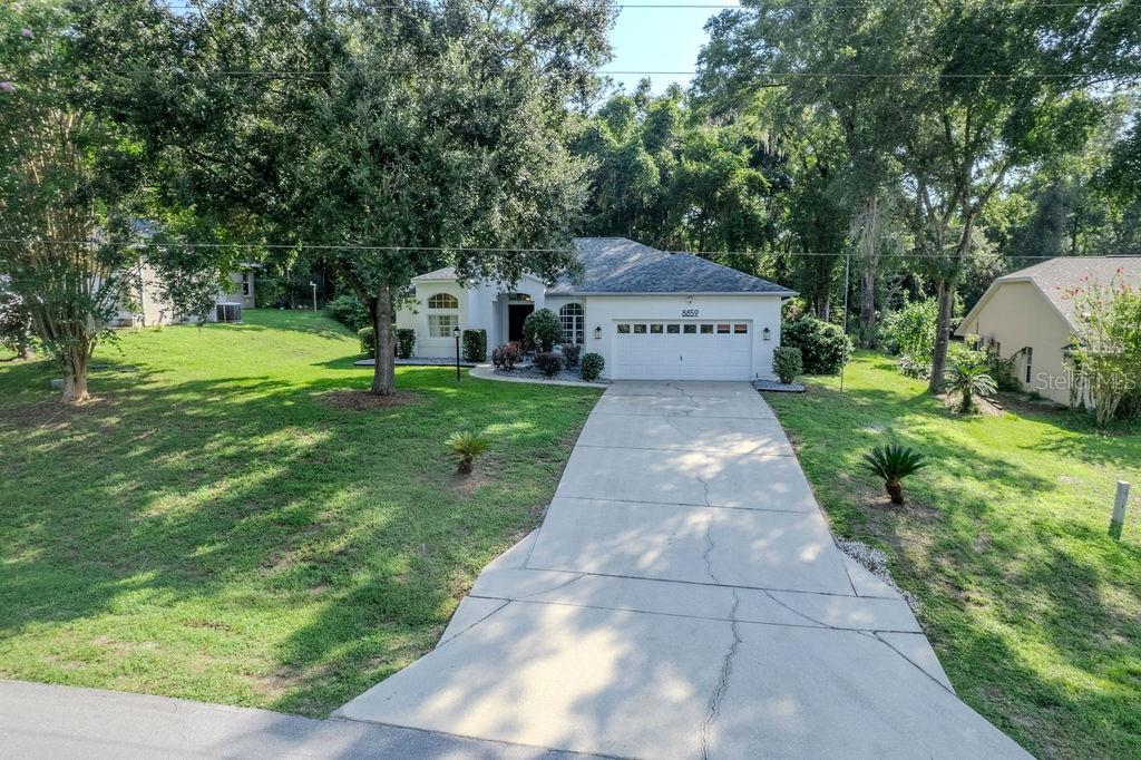 Welcome to your new home in the highly sought-after Rainbow Springs community in Dunnellon! This beautifully maintained 3-bedroom, 2-bath residence features a spacious open floor plan with split bedrooms for added privacy and inside laundry. Enjoy the convenience of a 2-car garage and recent updates including fresh interior and exterior paint, rejuvenated landscaping at front entrance, new carpet, updated lighting, and professional cleaning. Major systems include a 2020 roof and a 2014 HVAC system for peace of mind. The property backs up to a 3.7-acre wooded green space owned by the HOA, offering privacy and natural beauty. Located just minutes from the Rainbow Springs River Access Park, you’ll have easy access to one of Florida’s most stunning natural attractions. Rainbow Springs HOA is only $246 per year and includes an impressive array of amenities: private access to the Rainbow River, clubhouse, community pool, tennis courts, pickleball, billiards room, exercise room, on-site restaurant, and much more. Don’t miss this opportunity to live in a vibrant community surrounded by nature and recreation yet only minutes away from shopping and all the amenities that Dunnellon & Ocala have to offer.