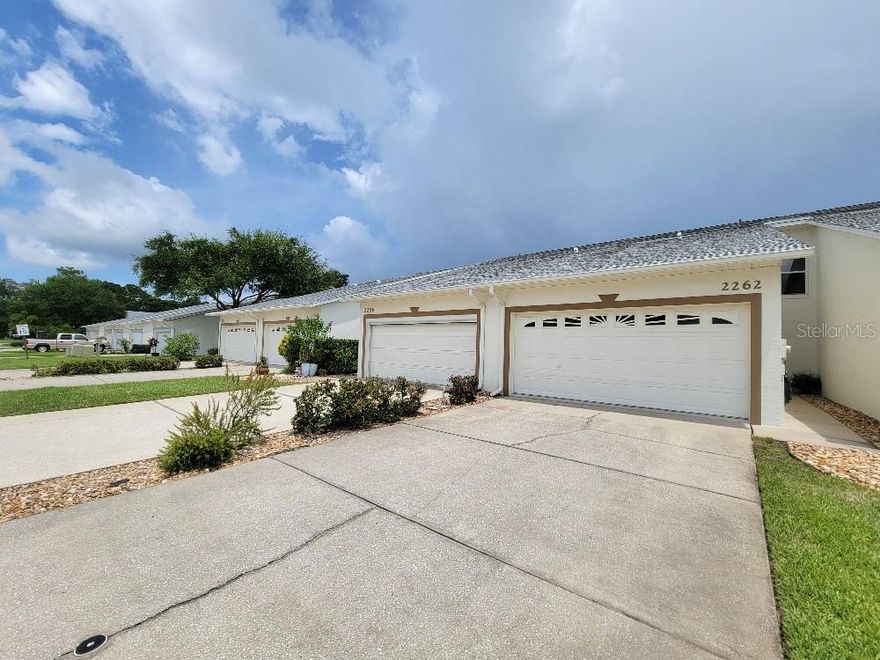 Enjoy the outdoors from your waterfront screened porch, under shade of oak trees fronting nice pond. Low HOA dues provide building insurance coverage, lawn care and sprinkler system, termite bond, exterior maintenance that includes the roof. The amenity package offers large pool, spa, spacious clubhouse with full kitchen, lighted tennis courts, and shuffleboard. Great central location, close to shopping, Publix, Walgreens and restaurants. Historic Canal Street shops and restaurants are nearby, and Flagler Avenue and the beach are 10 minutes away. This spacious townhome offers the convenience of two bedroom suites with private bathroom and walk-in closets, one on ground floor. The larger bedroom on second floor features attached office space and twin walk-in closets. The living space has soaring ceilings and has a nice view of the pond. Kitchen has cozy breakfast nook and 2021 refrigerator. A/C is 2015 and water heater is 2020. With no outside maintenance worries, this is the perfect home for those looking for a carefree lifestyle, and would make a great primary or second home. ;Water: City