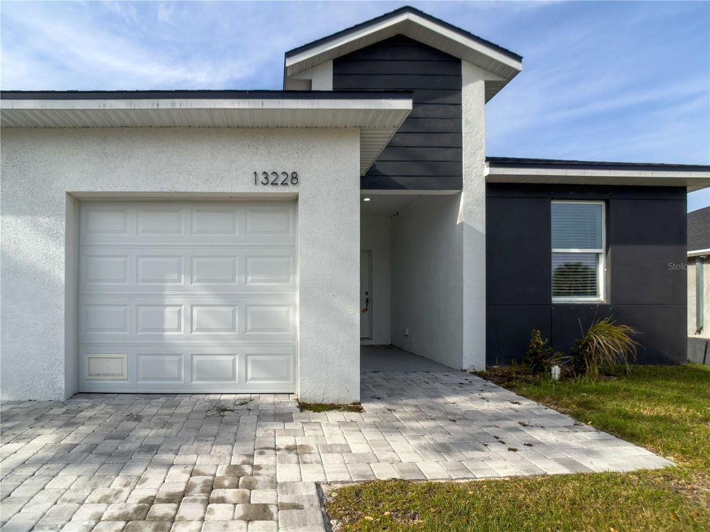 Photo of 13228 Blytheville Avenue Avenue, Port Charlotte, FL 33981 (MLS # O6394851)