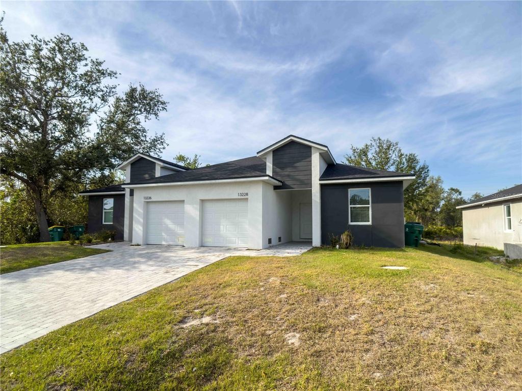 Photo of 13228 Blytheville Avenue Avenue, Port Charlotte, FL 33981 (MLS # O6394851)