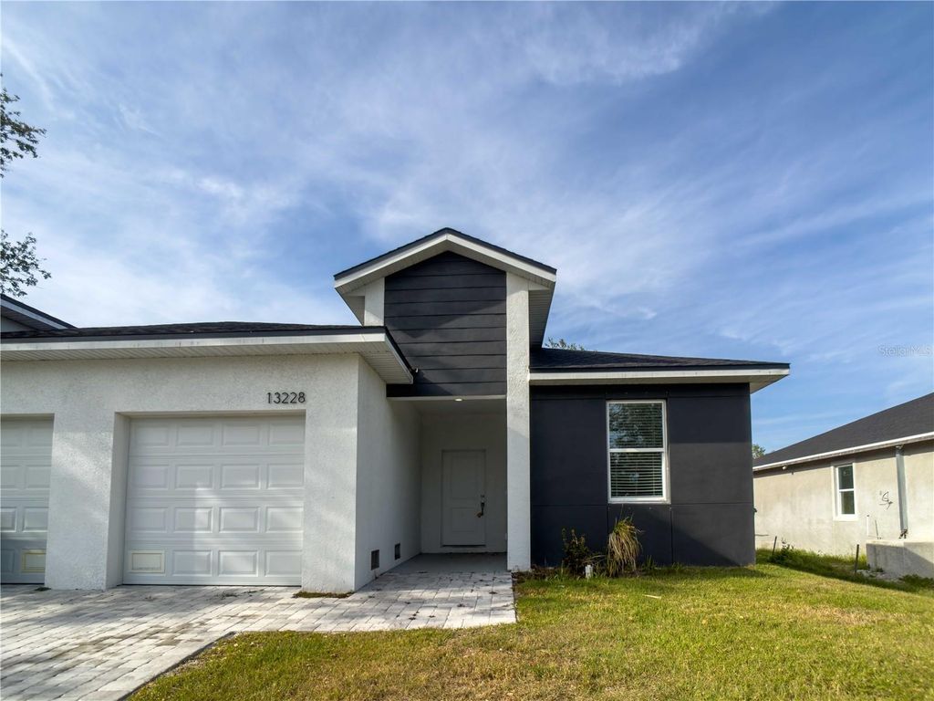 Photo of 13228 Blytheville Avenue Avenue, Port Charlotte, FL 33981 (MLS # O6394851)