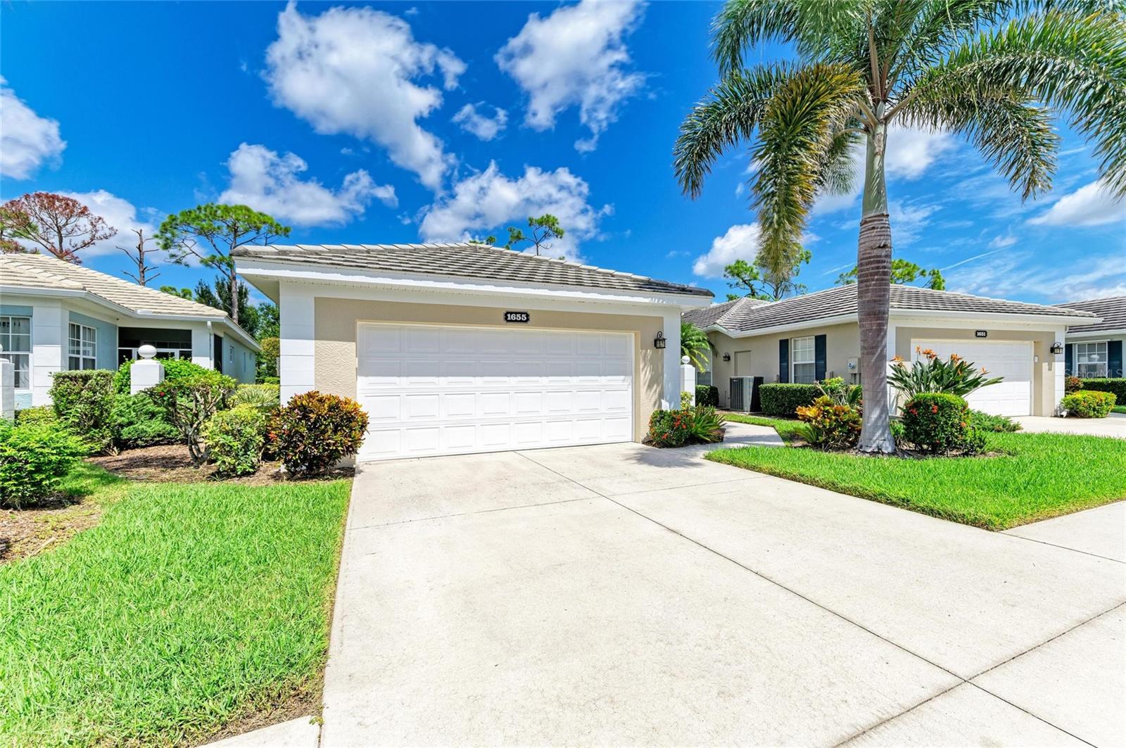 Carefree Florida Living in Plantation Golf & Country Club
Enjoy the ultimate low-maintenance lifestyle in this beautifully appointed former model home located in the charming Buckingham Meadows enclave, part of the highly sought-after Plantation Golf & Country Club. From the moment you arrive, you'll appreciate a layout designed for both comfort and entertaining, paired with the peace of mind that comes from living in a maintenance-free community.
This light-filled residence features three bedrooms and two and a half bathrooms, thoughtfully arranged to provide privacy, functionality, and inviting spaces for gathering. Soaring ceilings and abundant natural light enhance the sense of openness throughout the main living areas, while the well-designed floor plan allows each space to flow seamlessly into the next.
At the heart of the home lies a spacious kitchen that’s sure to delight any home chef. Outfitted with granite countertops, stainless steel appliances, and a built-in coffee bar, it also includes an inviting eat-in nook and plantation shutters that add a touch of Southern charm. The kitchen opens directly to the great room, a bright and airy combination of dining and living space, perfect for entertaining or relaxing with family. A cozy conversation area just off the main room offers a more intimate setting, ideal for quiet moments or casual chats.
The primary suite is a true retreat, complete with a large walk-in closet and a private en-suite bath for your comfort and convenience. A second bedroom also enjoys its own en-suite bathroom and walk-in closet, making it ideal for guests. The third bedroom, located at the front of the home, is currently used as a home office and features plantation shutters and generous natural light, making it a versatile and inspiring space.
Step outside to discover a serene escape—your own private, screened lanai surrounded by lush tropical landscaping, where you can unwind in total privacy and enjoy peaceful mornings or tranquil evenings in nature.
As part of Buckingham Meadows, residents have access to a large community pool and clubhouse, which serves as a hub for neighborhood social events and gatherings. And while membership at Plantation Golf & Country Club is available for those looking to enjoy additional amenities, it’s completely optional—allowing you to tailor your lifestyle to your preferences.
To top it all off, your association fee covers nearly everything for a worry-free experience. This includes exterior building maintenance from the drywall out, wind and hazard insurance, pest control, landscaping and lawn care, roof replacement, exterior painting, building insurance and paint reserves, private road upkeep, and even common area taxes. With so much included, you can focus on enjoying your home—not maintaining it.
Offering a blend of open living spaces, private outdoor areas, and unmatched community convenience, this home presents a rare opportunity to experience the very best of Florida living in a tranquil, resort-style setting.