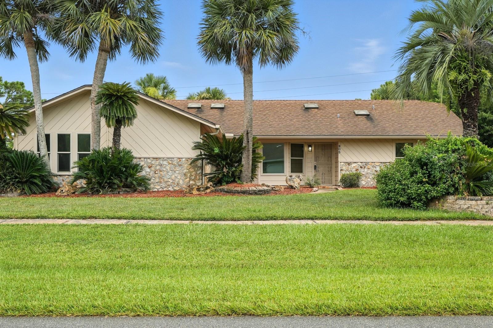 One or more photo(s) has been virtually staged. Welcome to 905 Pelican Bay Drive, a beautifully maintained home located in the prestigious gated golf community of Pelican Bay. This spacious residence offers the perfect blend of comfort, elegance, and Florida lifestyle living. Featuring a bright and open floor plan with generous living areas, including a charming double-sided fireplace that adds warmth and character to both the living and dining spaces. Enjoy your morning coffee or unwind in the covered screened patio overlooking the peaceful, moving water canal—an ideal spot for relaxation. The large primary suite includes a walk-in closet and private bath, while the well-equipped kitchen opens to a cozy breakfast nook. Additional highlights include vaulted ceilings, a two-car garage, and easy access to shopping, dining, I-95, and the world-famous beaches. Tucked away in a quiet neighborhood, yet close to everything Daytona Beach has to offer. Don't miss your chance to make this serene waterfront home your own! Piano included!
