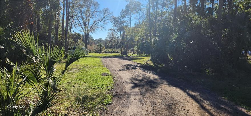 Rare opportunity to acquire 5 private acres in Northeast Florida featuring an under-construction single-family residence. Large acreage parcels in this location are becoming increasingly scarce, especially within minutes of Palm Coast and Bunnell.

The property is ideally situated between St. Augustine and Daytona Beach with convenient access to I-95 and US-1. Approximately 10 minutes to AdventHealth Palm Coast and Flagler Executive Airport, and about 25 minutes to Flagler Beach.

Significant improvements already completed include stem foundation and block first-floor construction, a 400-foot underground power line installed to the residence, and existing horse paddocks, tool shed, and pump house/storage structure. Plans, prior permits, surveys, and engineering reports are available and transferable (buyer to verify with county).

The parcel totals approximately 217,000 square feet (±5 acres), heavily wooded with mature trees offering privacy and flexibility for a rural estate, equestrian property, or investment resale opportunity.

Construction was halted due to owner relocation. Home is not completed. Buyer will be responsible for verifying status of permits with the county and may be required to obtain new permits and inspections to complete construction. Property is being sold strictly AS-IS.

Cash buyers only. Priced below estimated replacement cost.