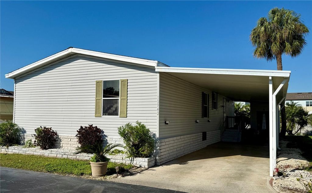 Photo of 10942 Poplar Street NE #111, St Petersburg, FL 33716 (MLS # TB8485694)